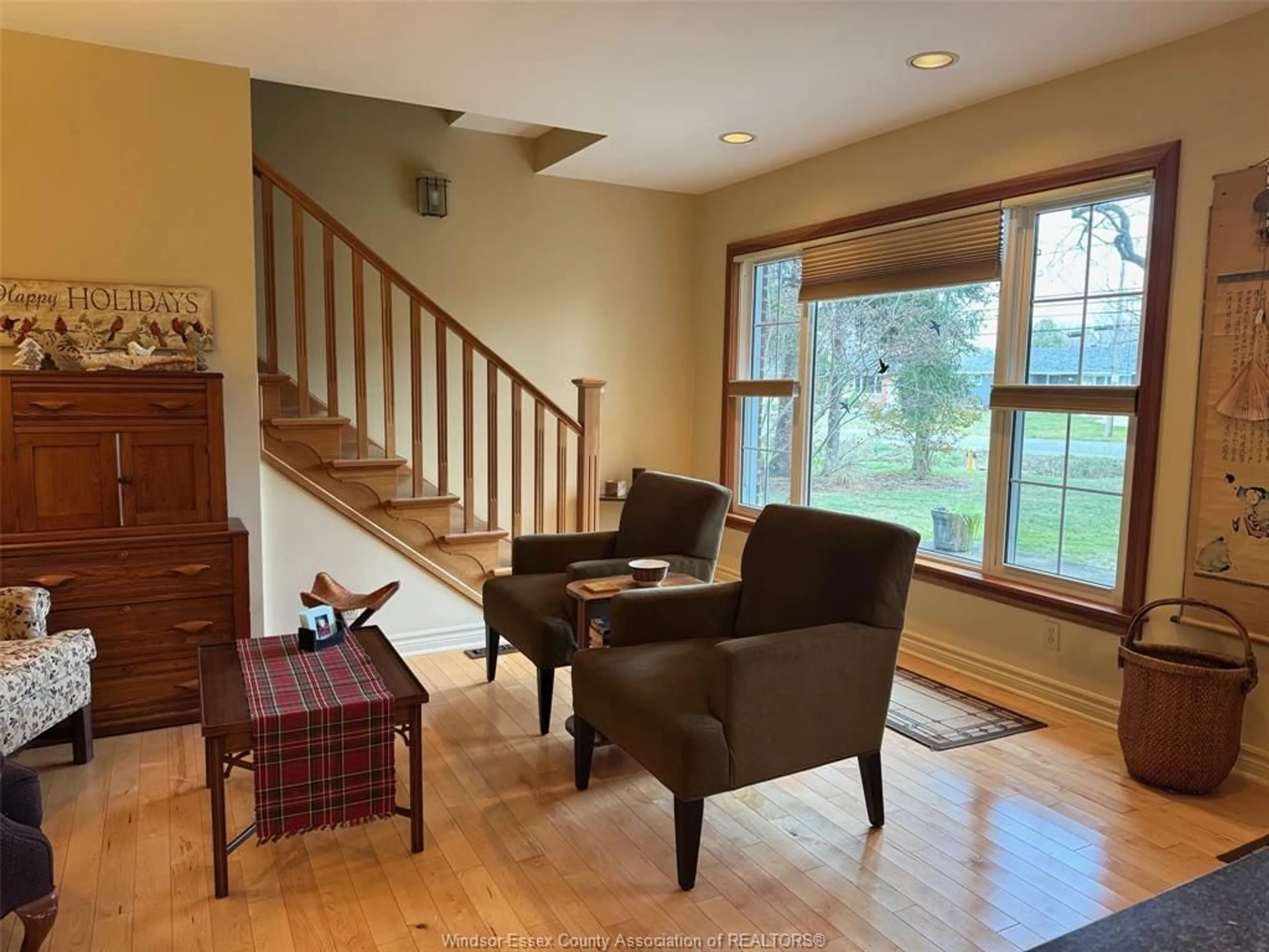 Living room with furniture, wood/laminate floor for 5080 MALDEN Rd, Windsor Ontario N9E 3T9