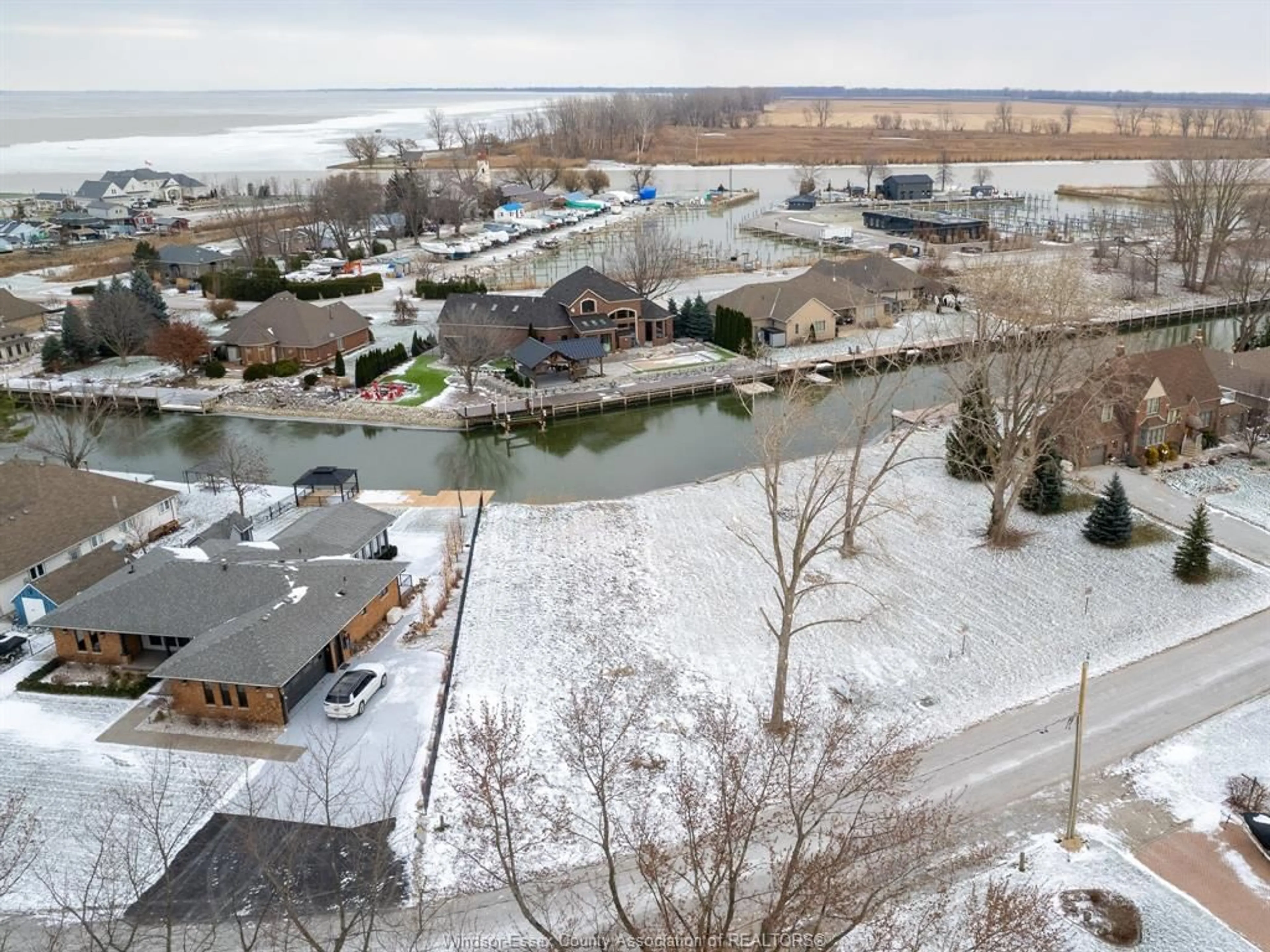 A pic from outside/outdoor area/front of a property/back of a property/a pic from drone, water/lake/river/ocean view for 19080 LIGHTCOVE Ave, Lakeshore Ontario N0P 2L0