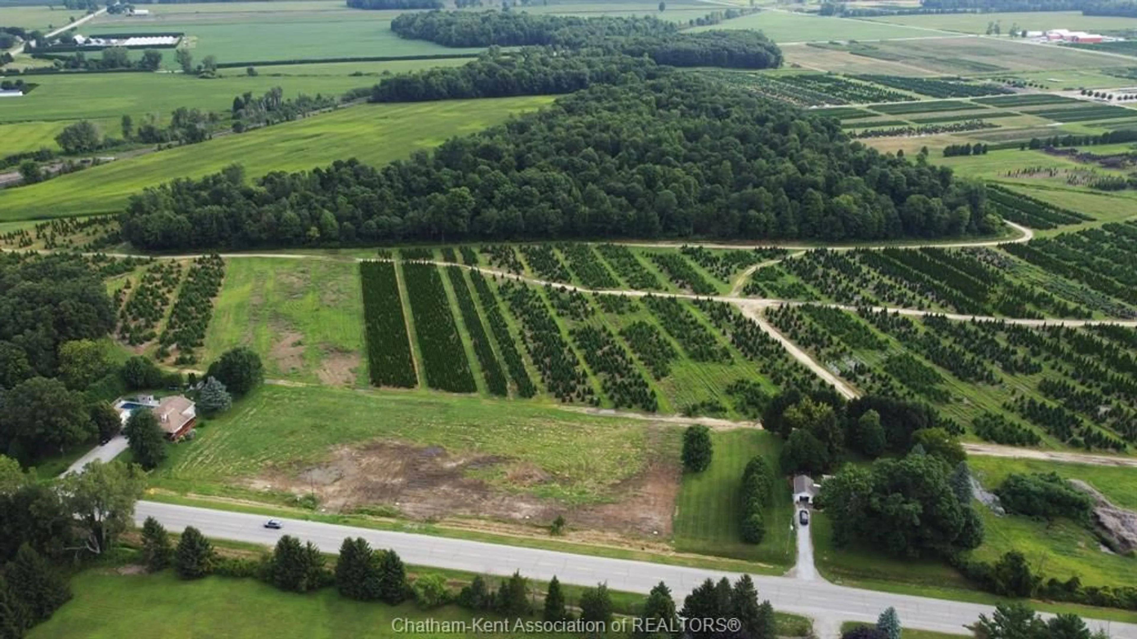 A pic from outside/outdoor area/front of a property/back of a property/a pic from drone, forest/trees view for 15013 MAIN Line, Bothwell Ontario N0P 1C0