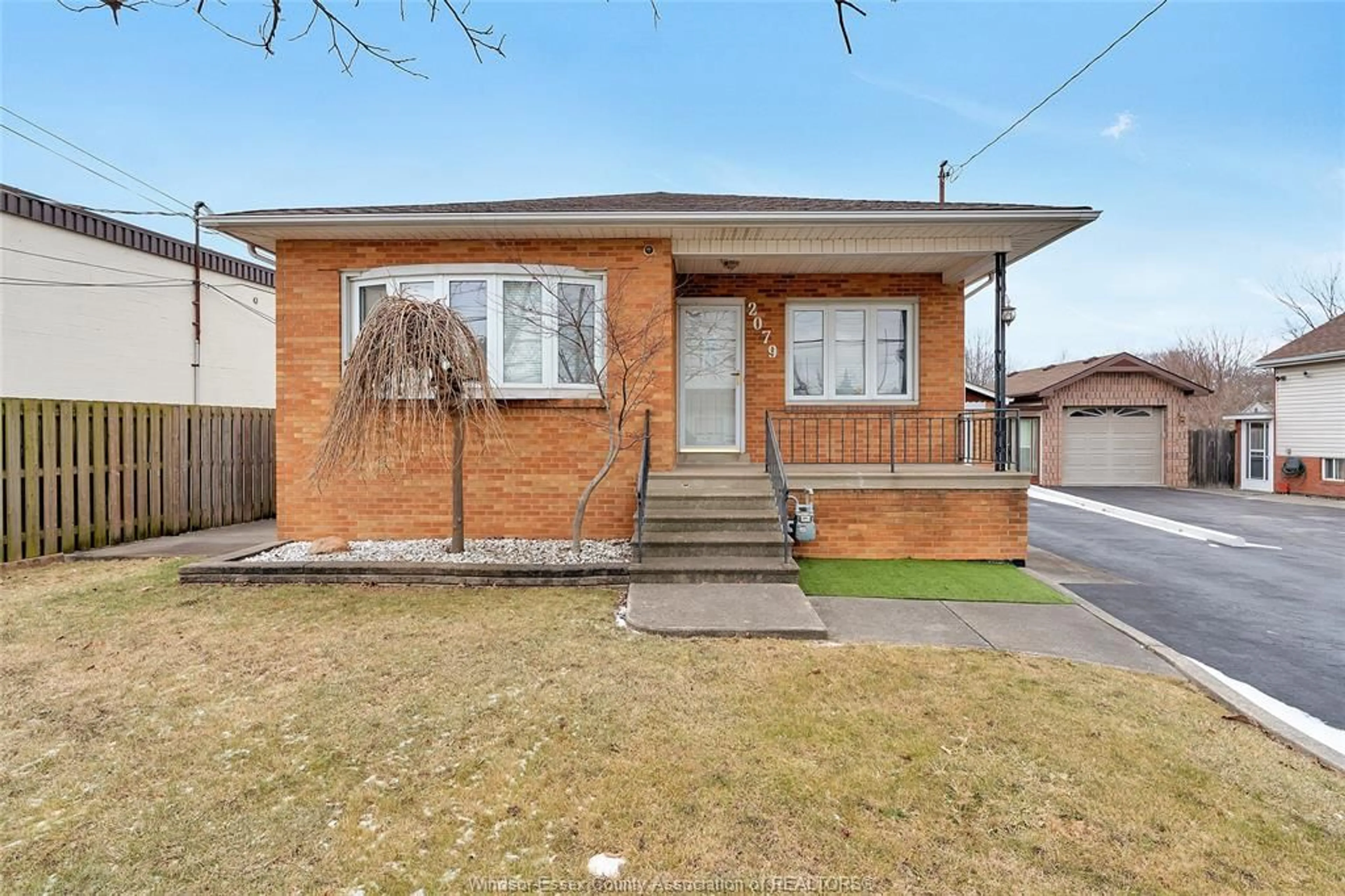 Home with brick exterior material, street for 2079 BALFOUR Blvd, Windsor Ontario N8T 2S6