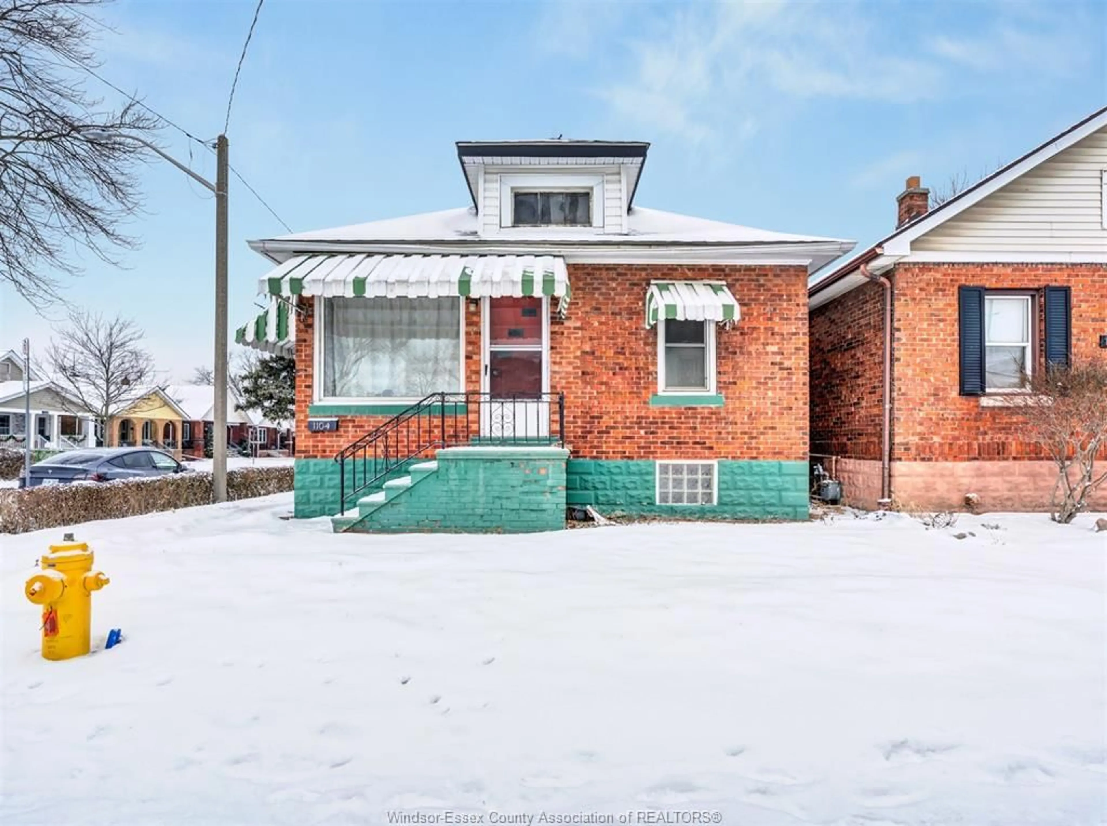 Home with brick exterior material, street for 1104 ELLIS St, Windsor Ontario N8X 2J3