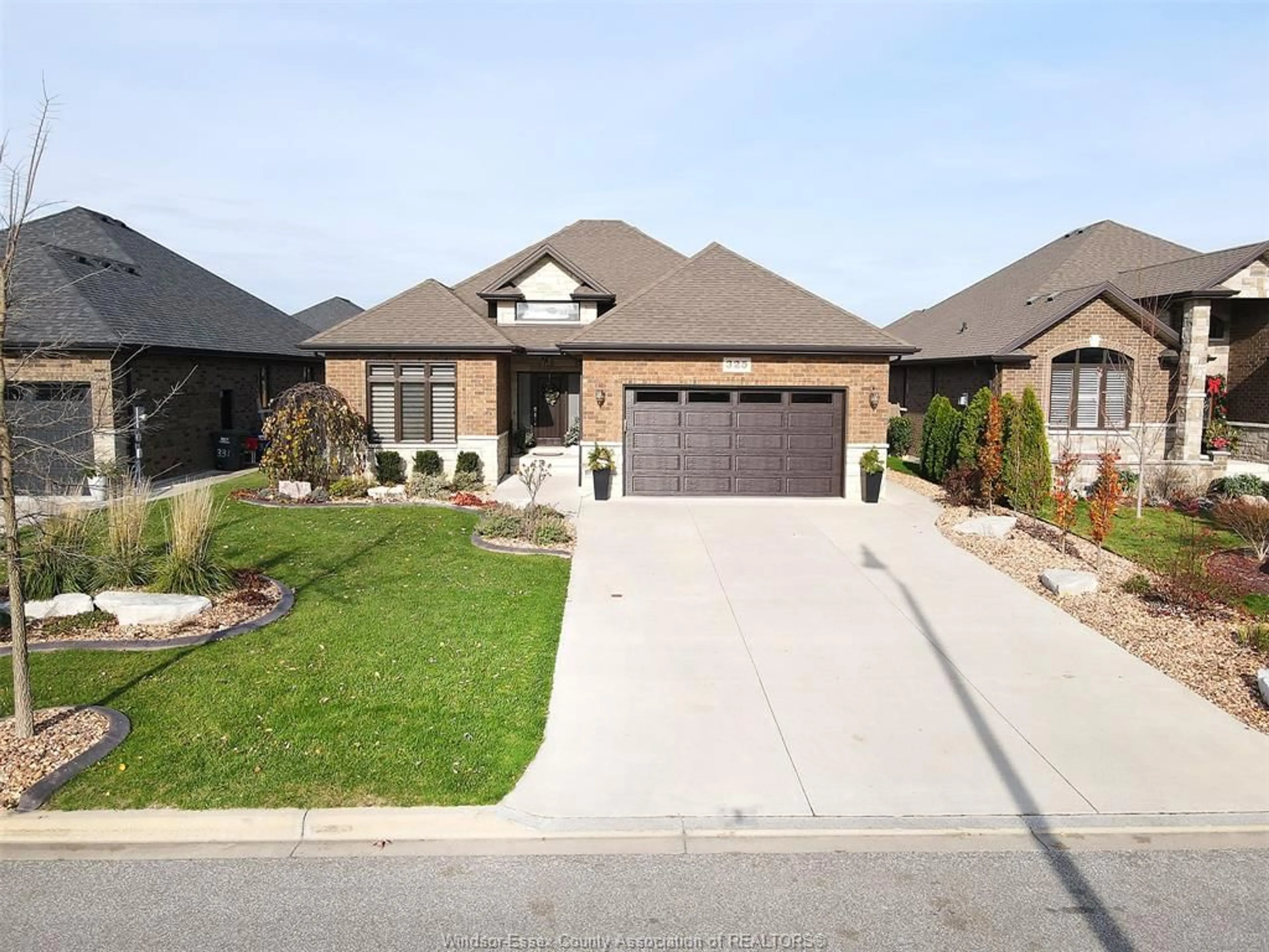 Home with brick exterior material, street for 325 LAKEWOOD Cres, Tecumseh Ontario N8N 1M2