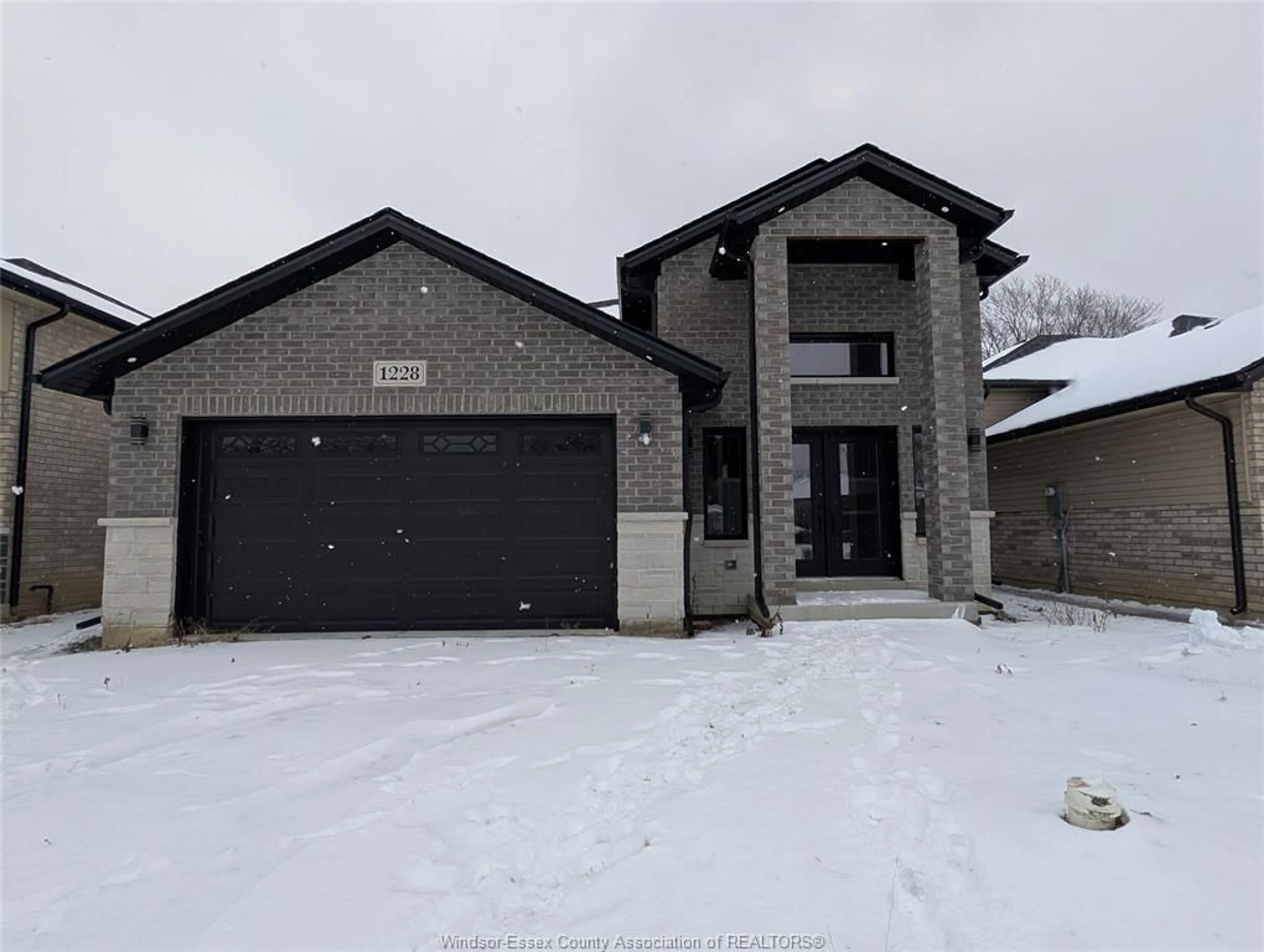 Home with brick exterior material, street for 1228 TOURANGEAU Rd, Windsor Ontario N8Y 0B2