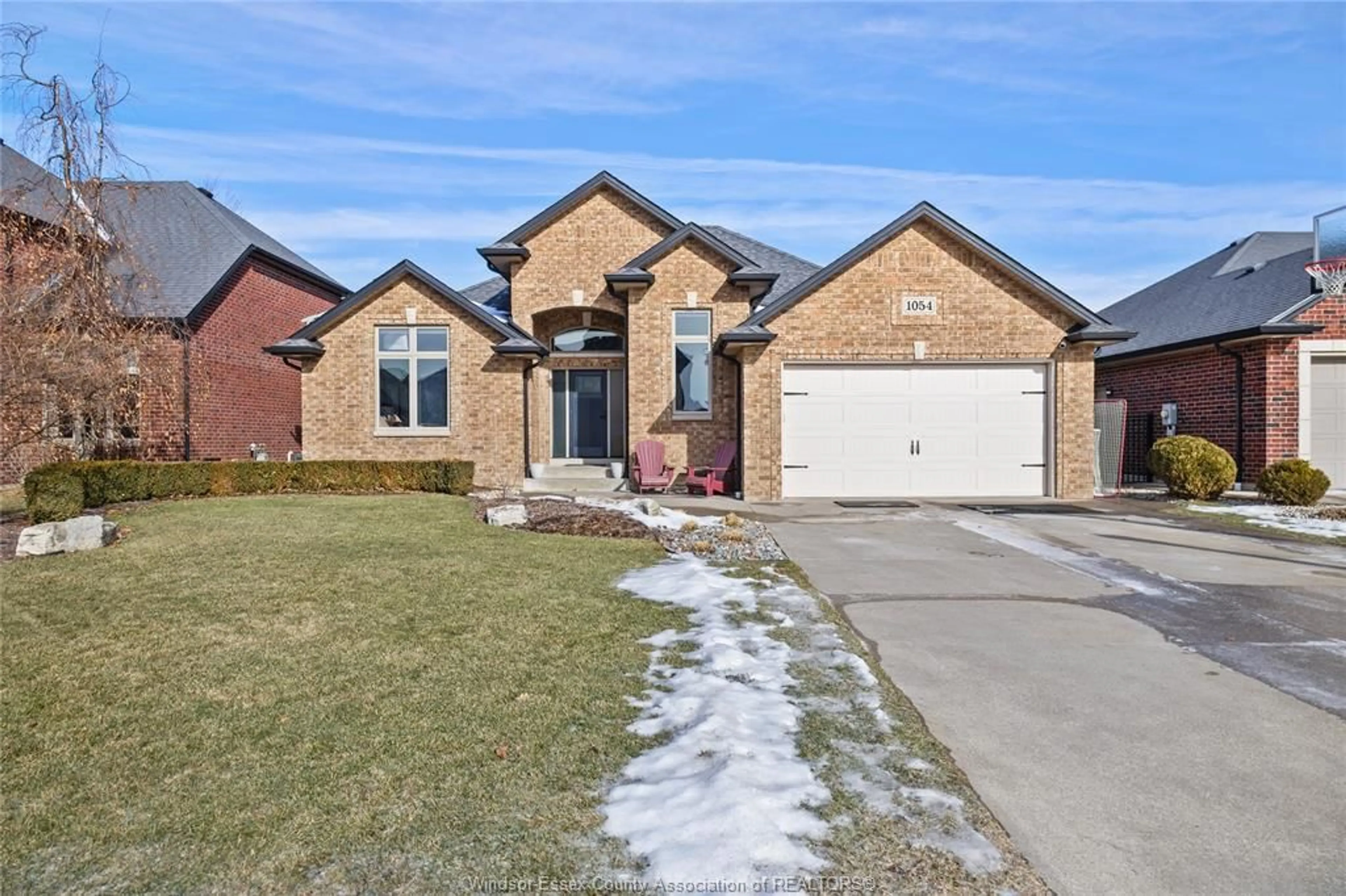 Home with brick exterior material, street for 1054 Woodland Cres, Lakeshore Ontario N0R 1A0