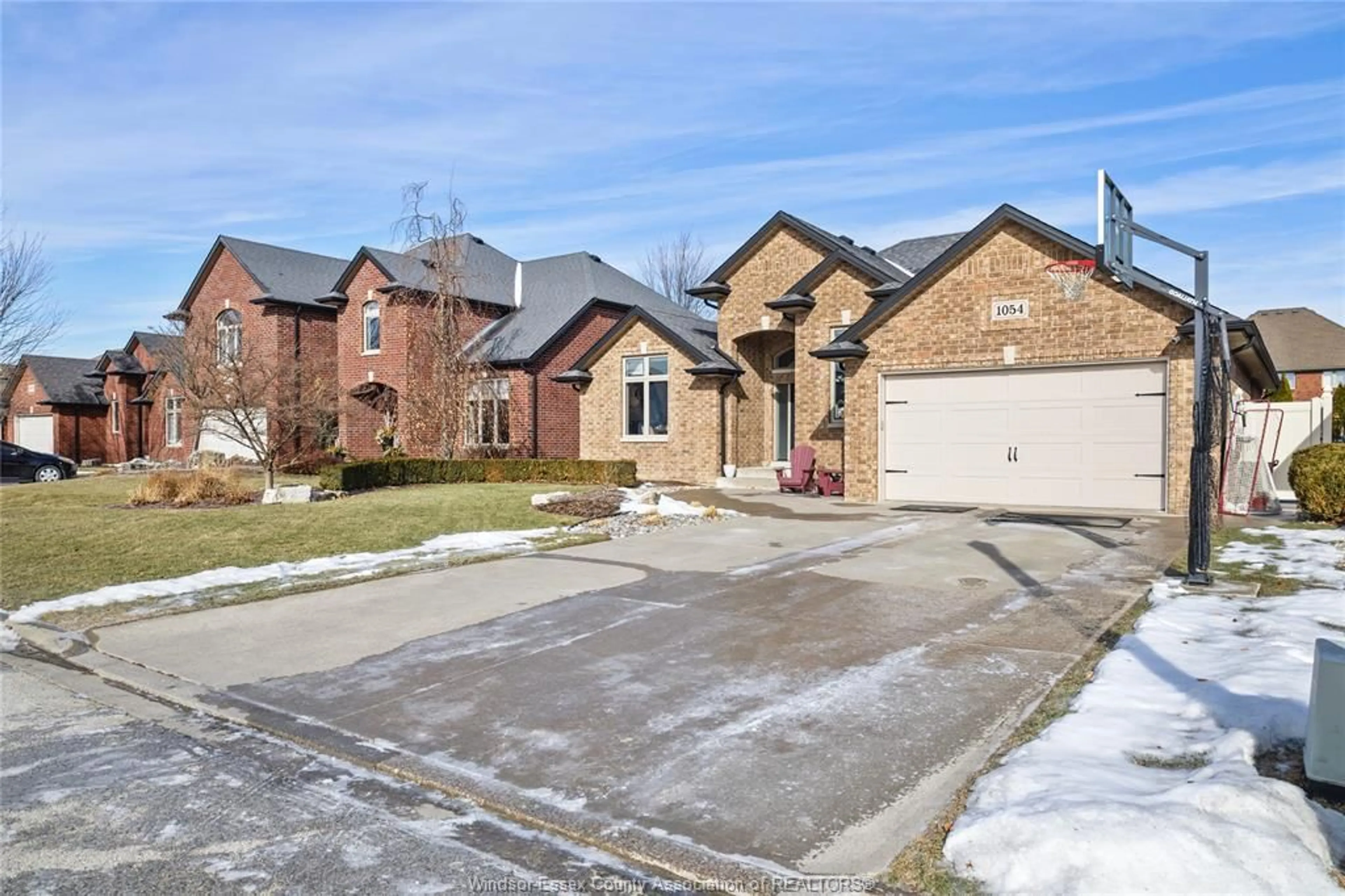 Home with brick exterior material, street for 1054 Woodland Cres, Lakeshore Ontario N0R 1A0