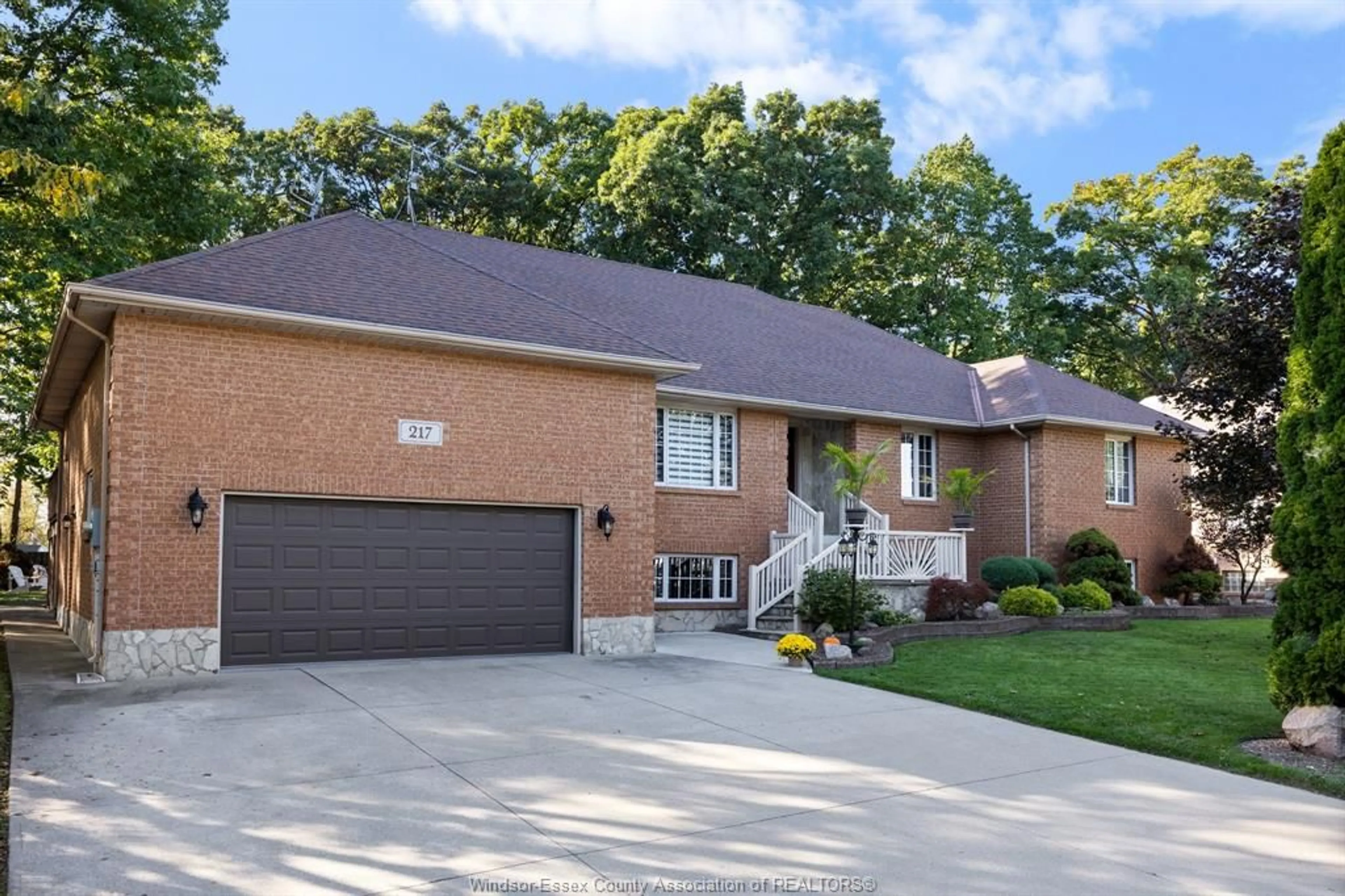 Home with brick exterior material, street for 217 WOODLAND Dr, Harrow Ontario N0R 1G0