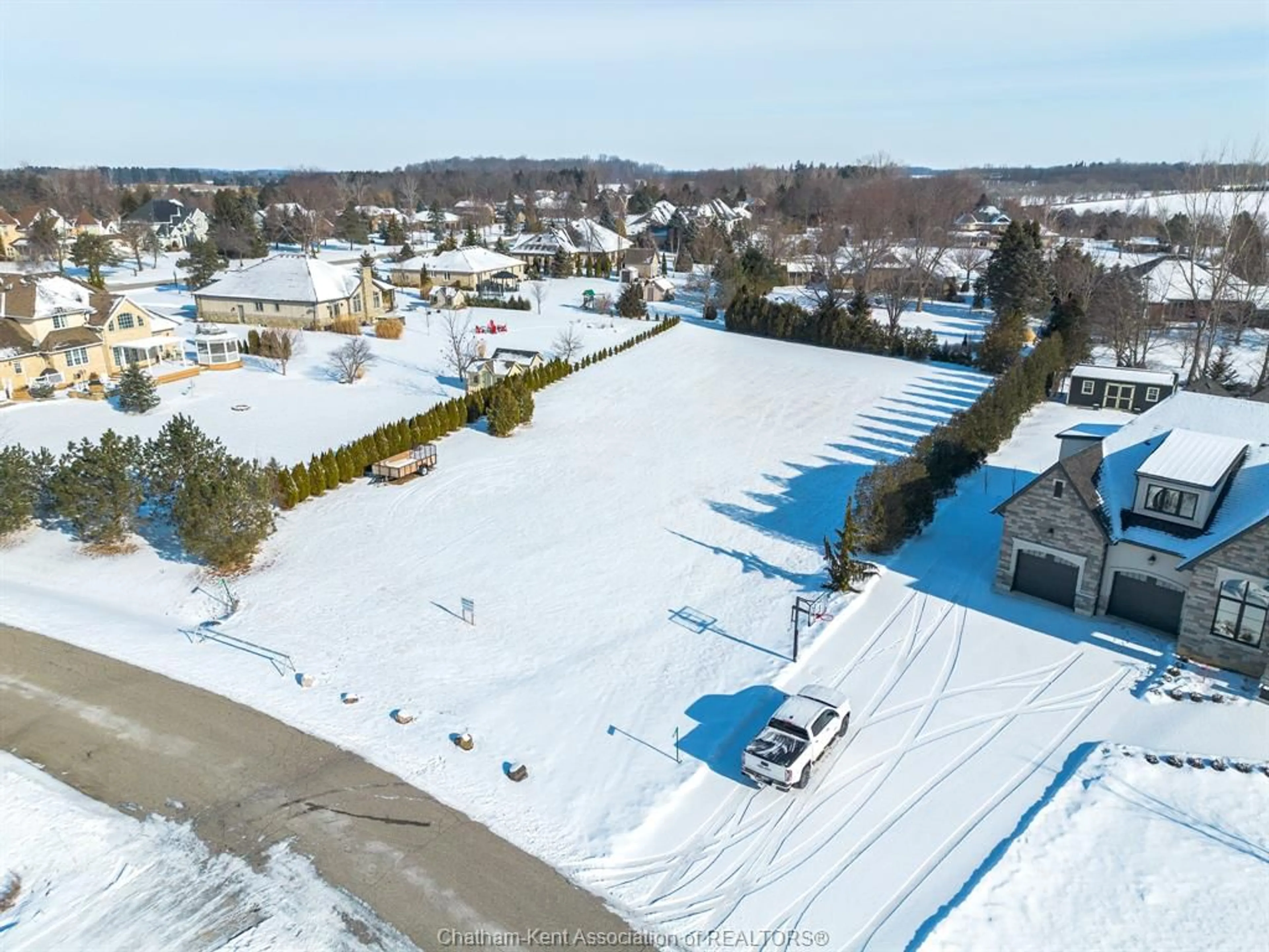 A pic from outside/outdoor area/front of a property/back of a property/a pic from drone, street for 21633 ADAMS Cres, Chatham Ontario N7M5J3