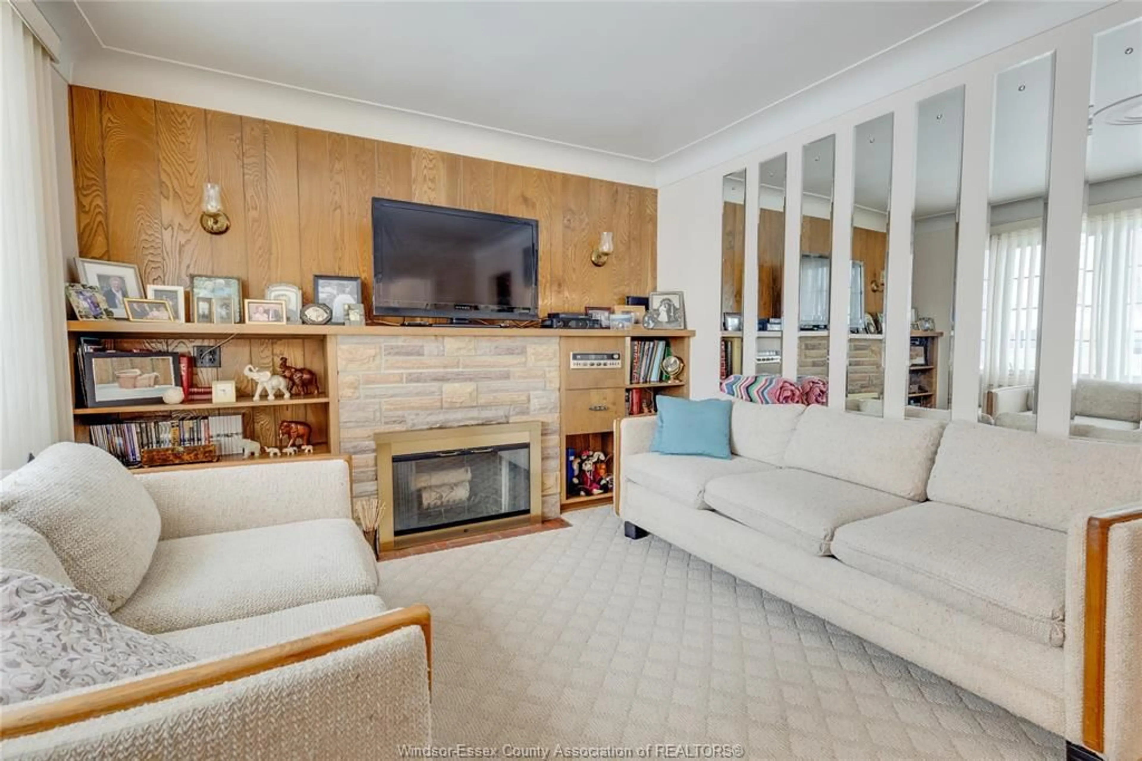 Living room with furniture, wood/laminate floor for 2702 TOURANGEAU Rd, Windsor Ontario N8W 4P3