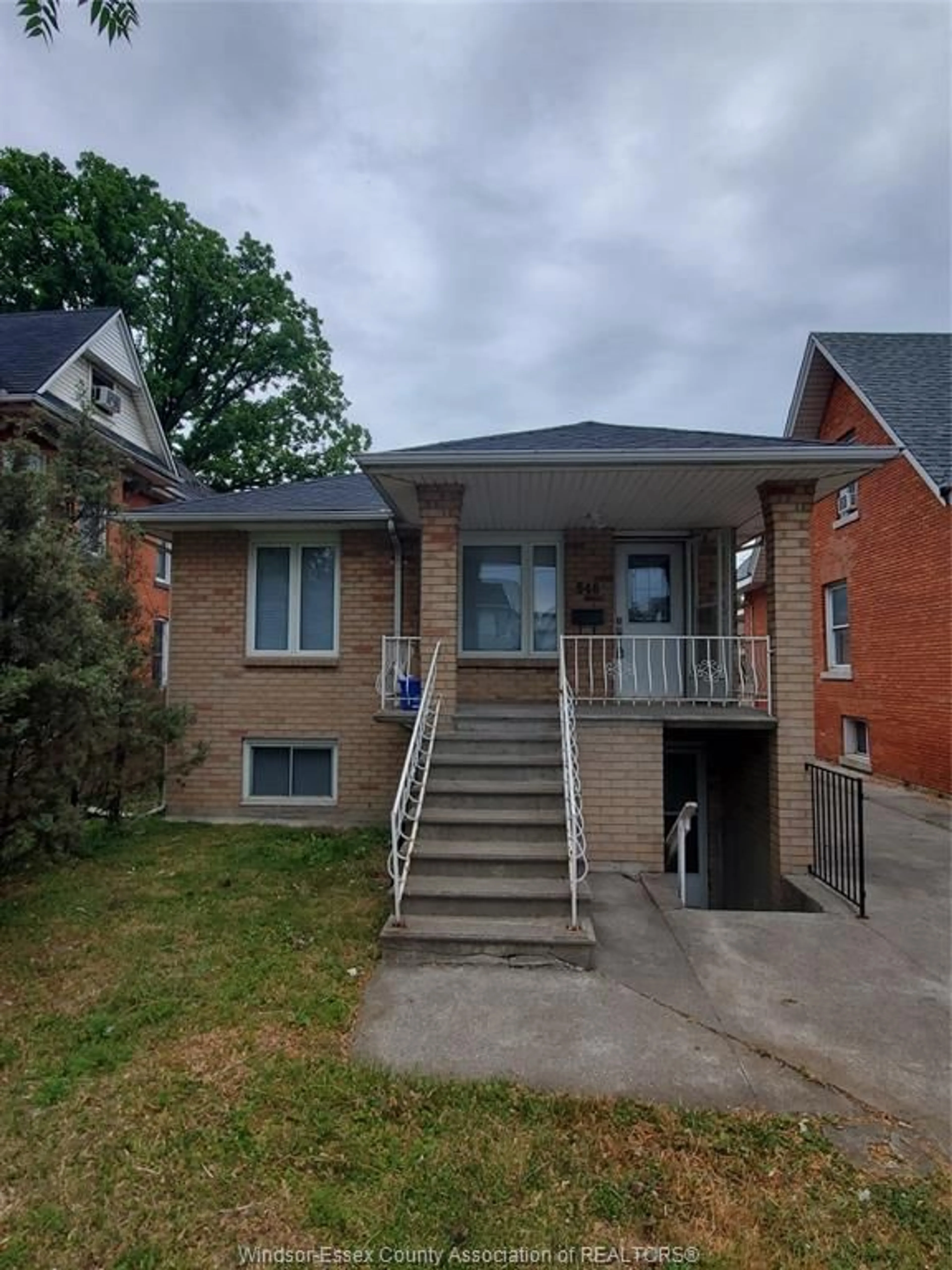 Home with brick exterior material, street for 548 CARON Ave, Windsor Ontario N9B 5B4