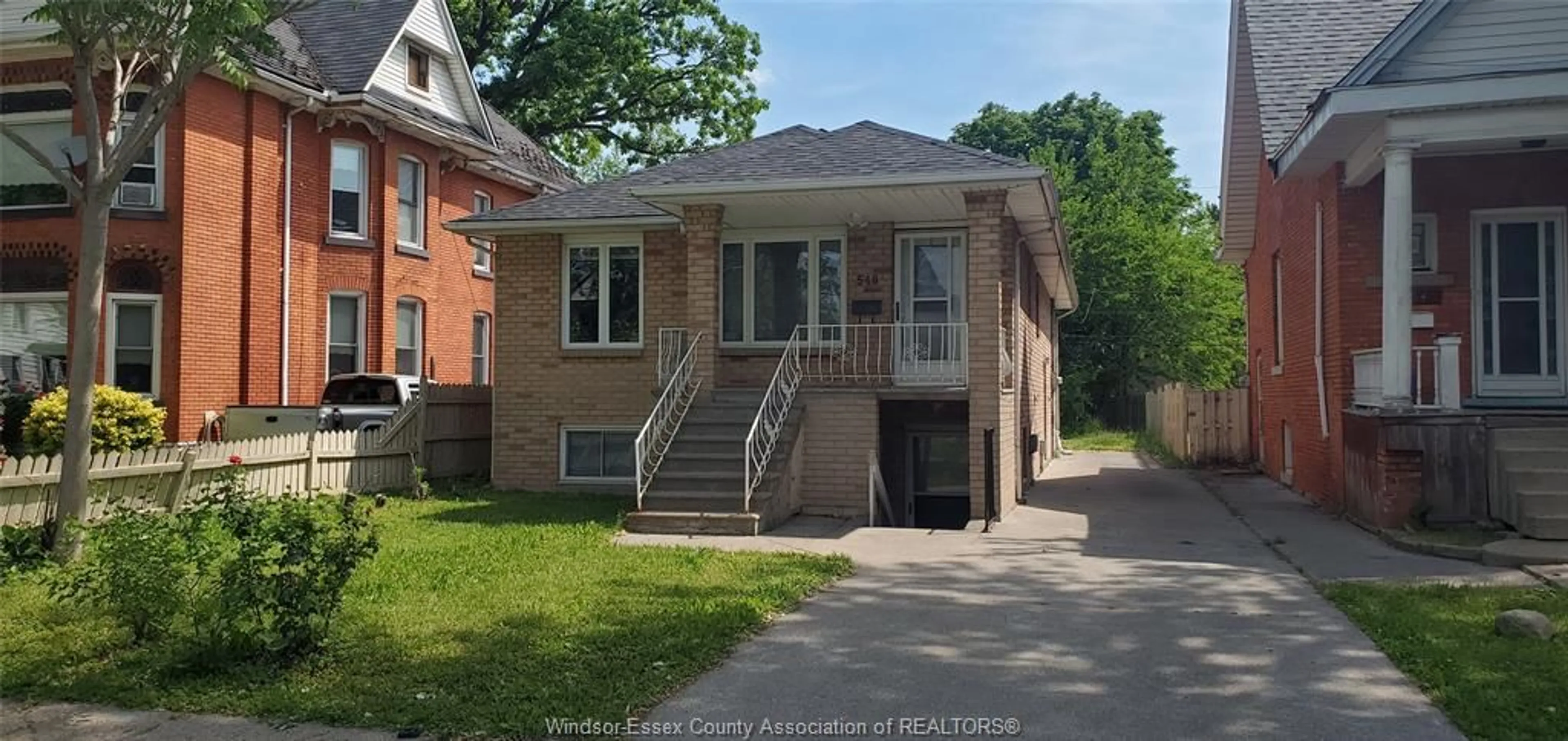 Home with brick exterior material, street for 548 CARON Ave, Windsor Ontario N9B 5B4