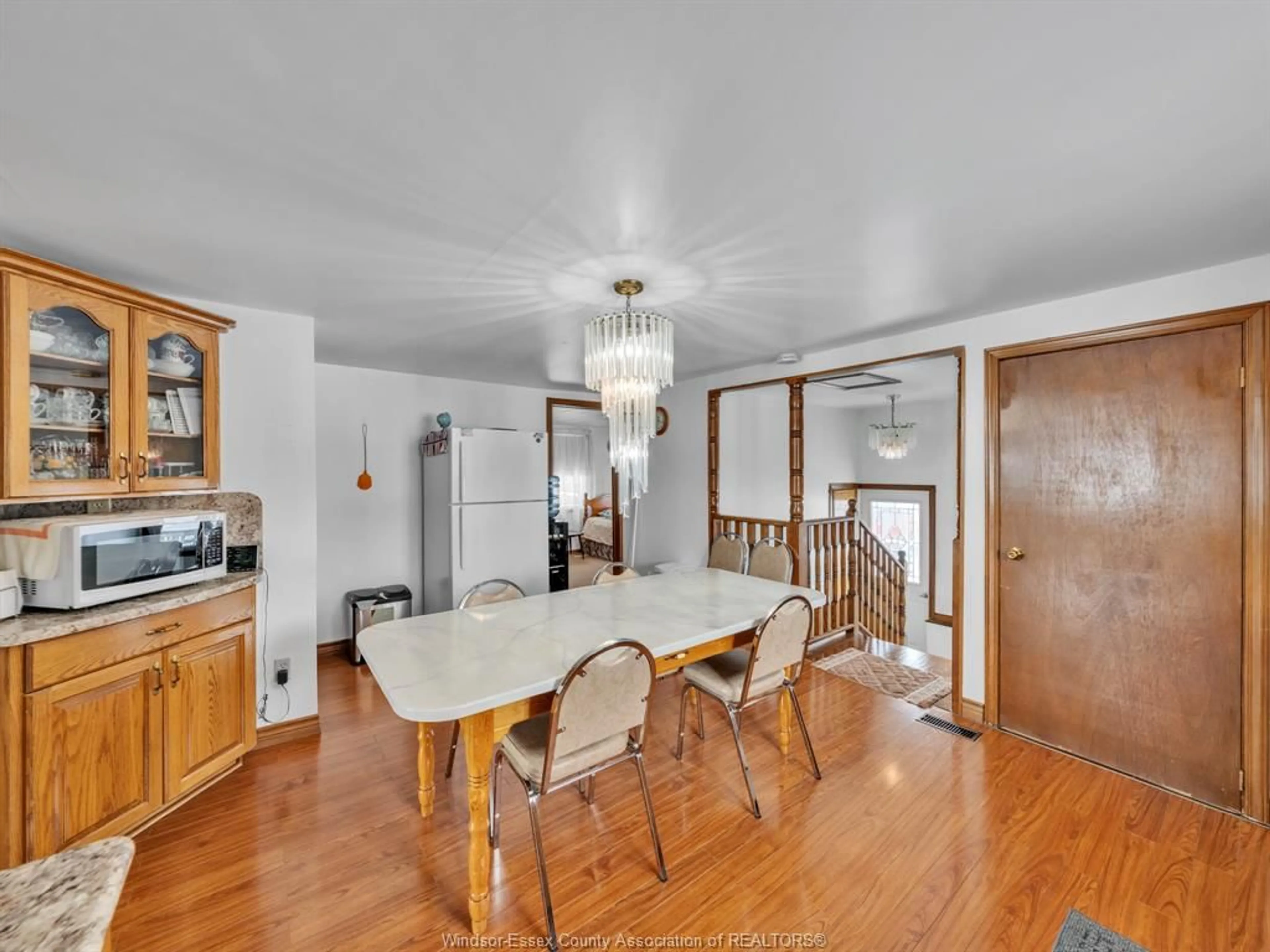 Dining room, wood/laminate floor for 637 Talbot Rd, Leamington Ontario N8H 3V6