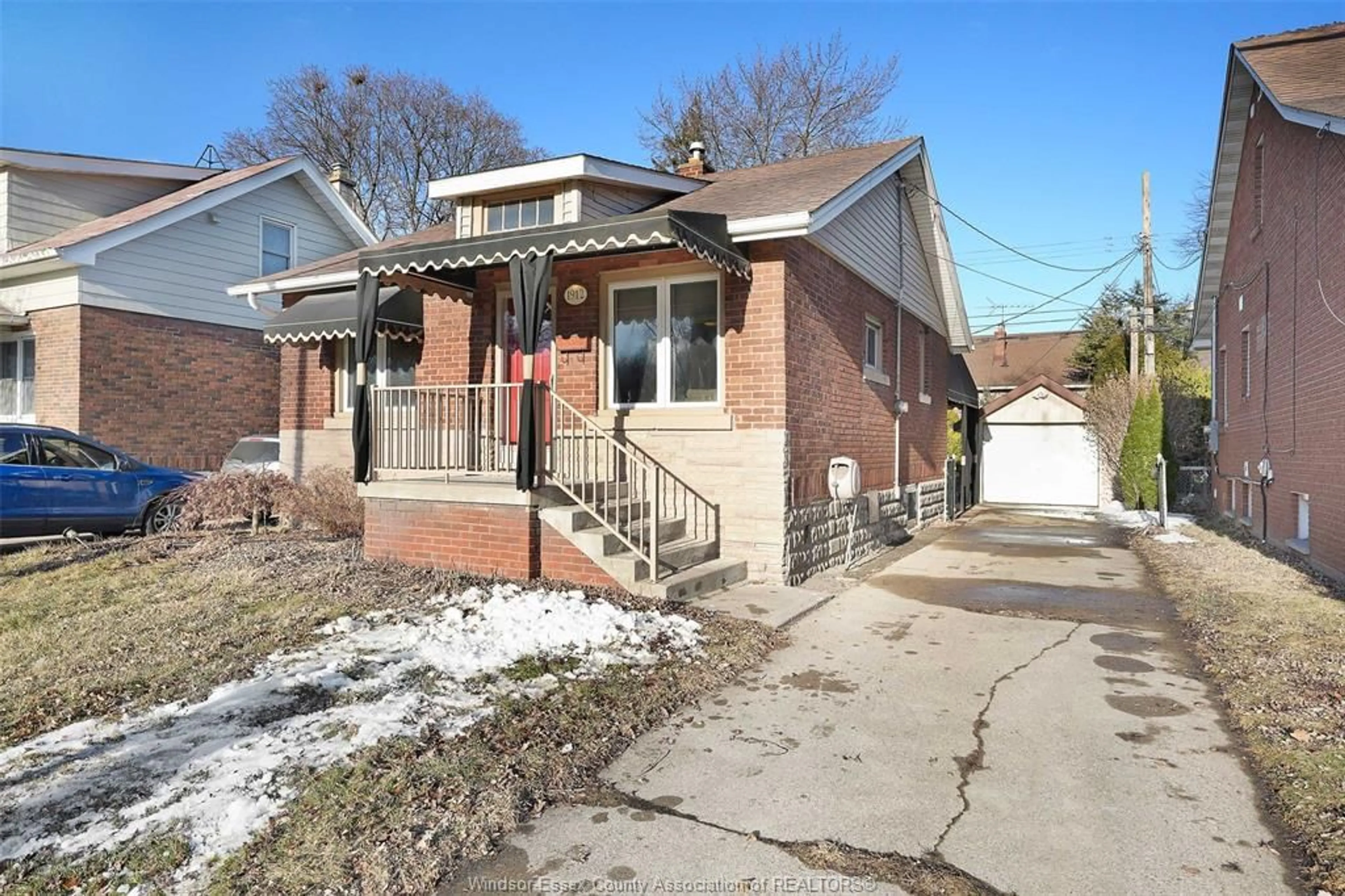 Home with brick exterior material, street for 1912 George, Windsor Ontario N8W4M1