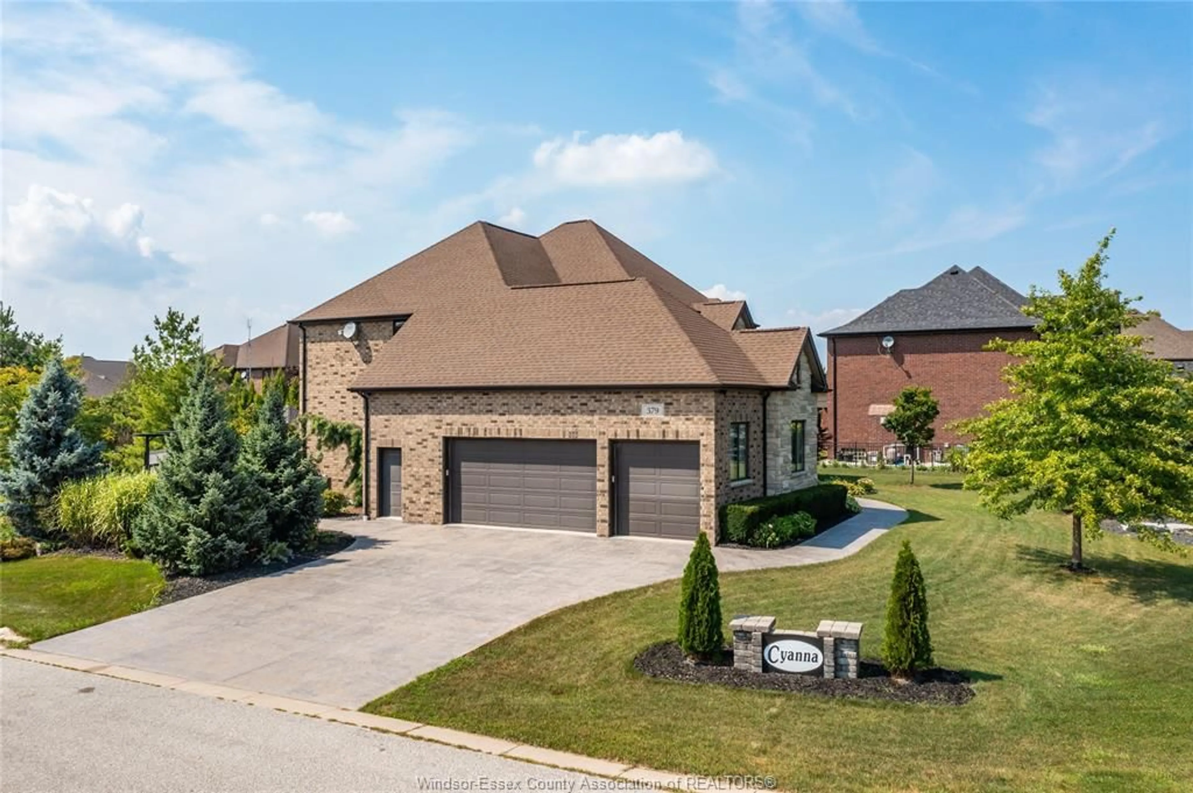 Home with brick exterior material, street for 379 STONEBROOK Blvd, Lakeshore Ontario N8N5H2