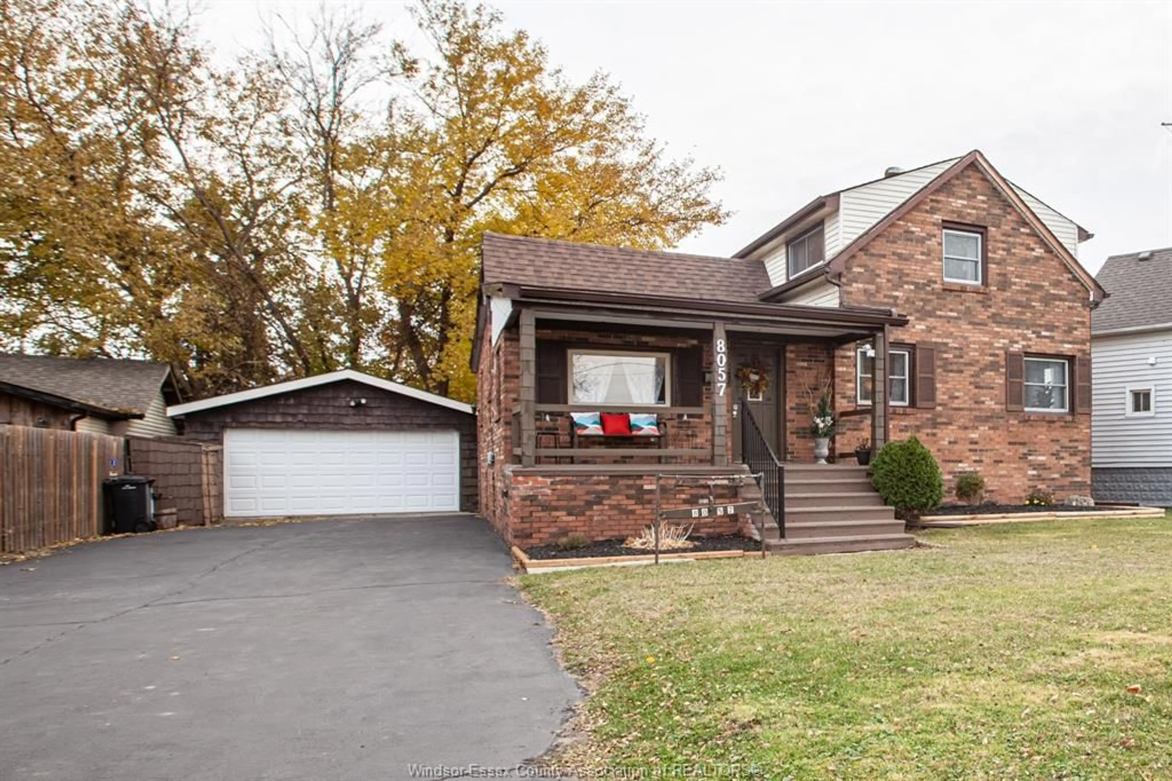 Home with brick exterior material, street for 8057 RIVERSIDE Dr, Windsor Ontario N8S 1E5