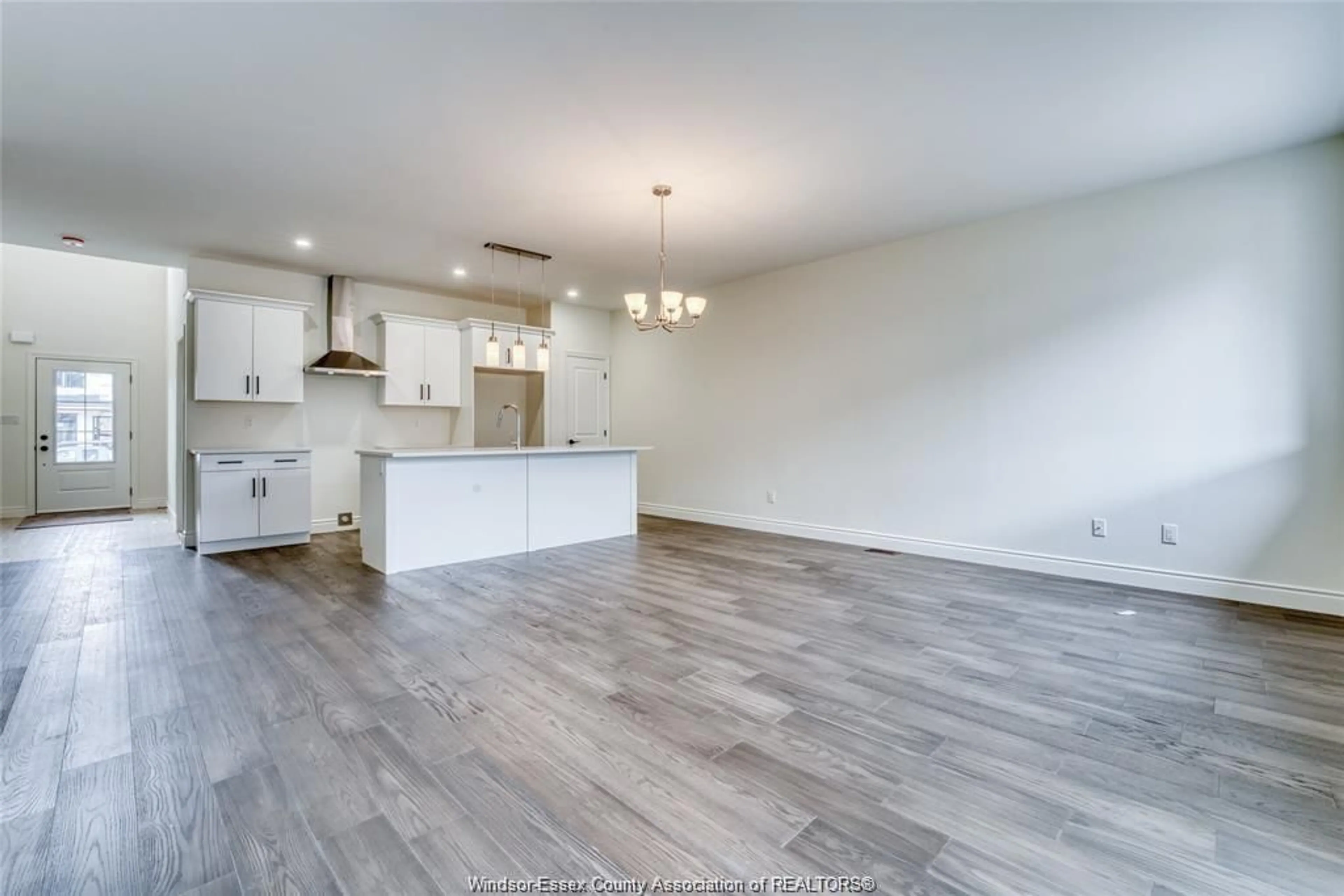 Open concept kitchen, wood/laminate floor for 702 ELLIOT POINT Rd, Amherstburg Ontario N9V 0H1