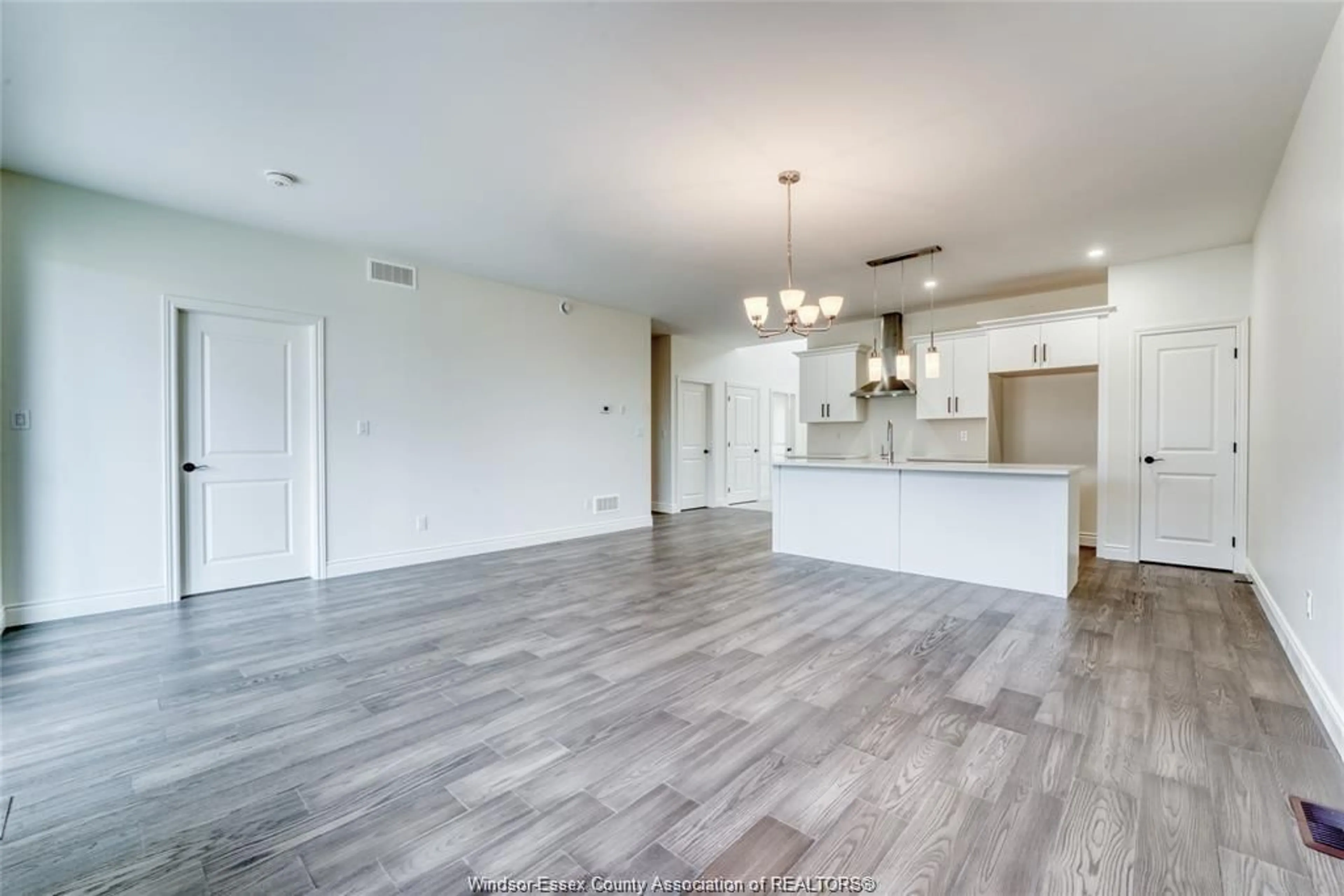 Open concept kitchen, wood/laminate floor for 702 ELLIOT POINT Rd, Amherstburg Ontario N9V 0H1