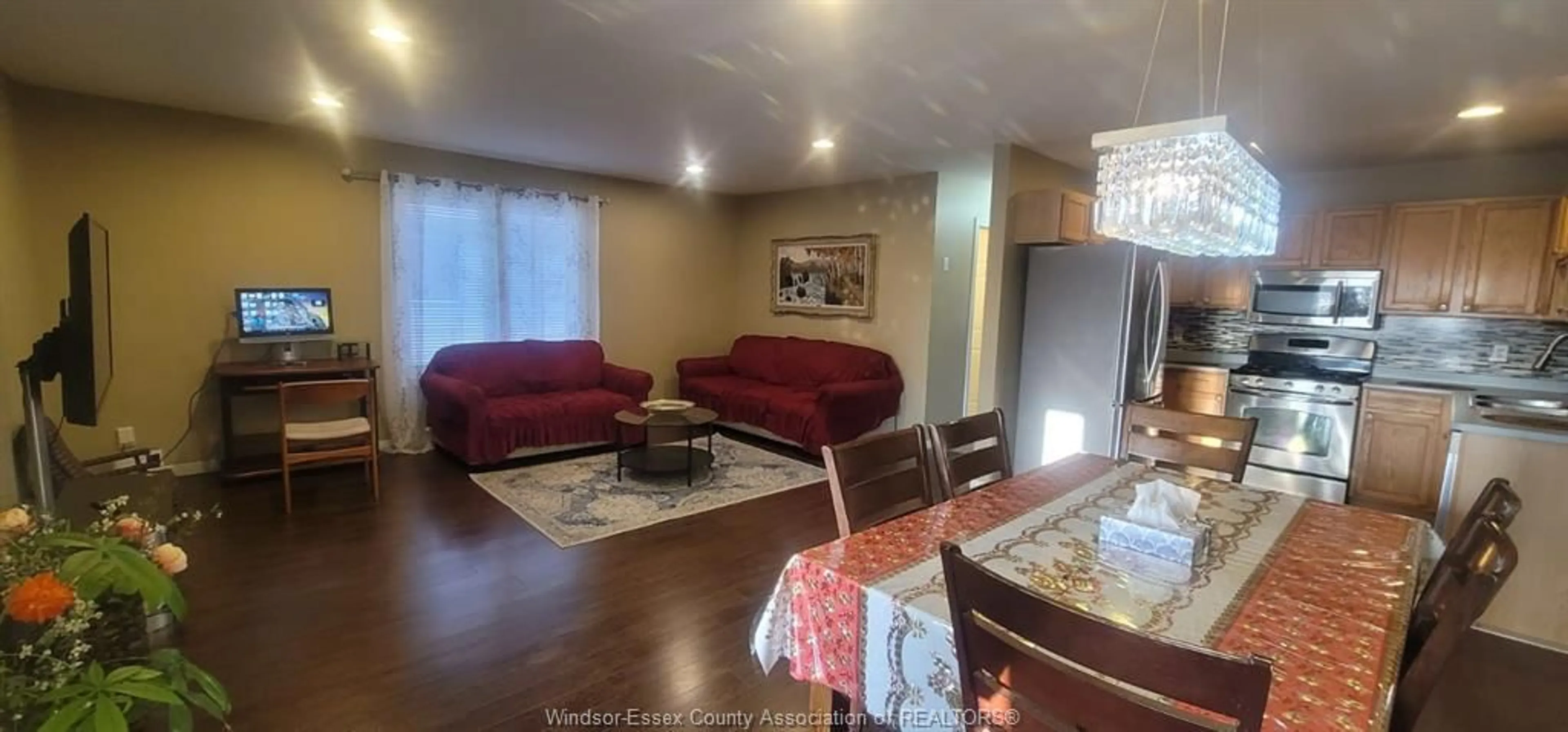 Living room with furniture, wood/laminate floor for 2680 TEEDIE, Windsor Ontario N8R 2K5