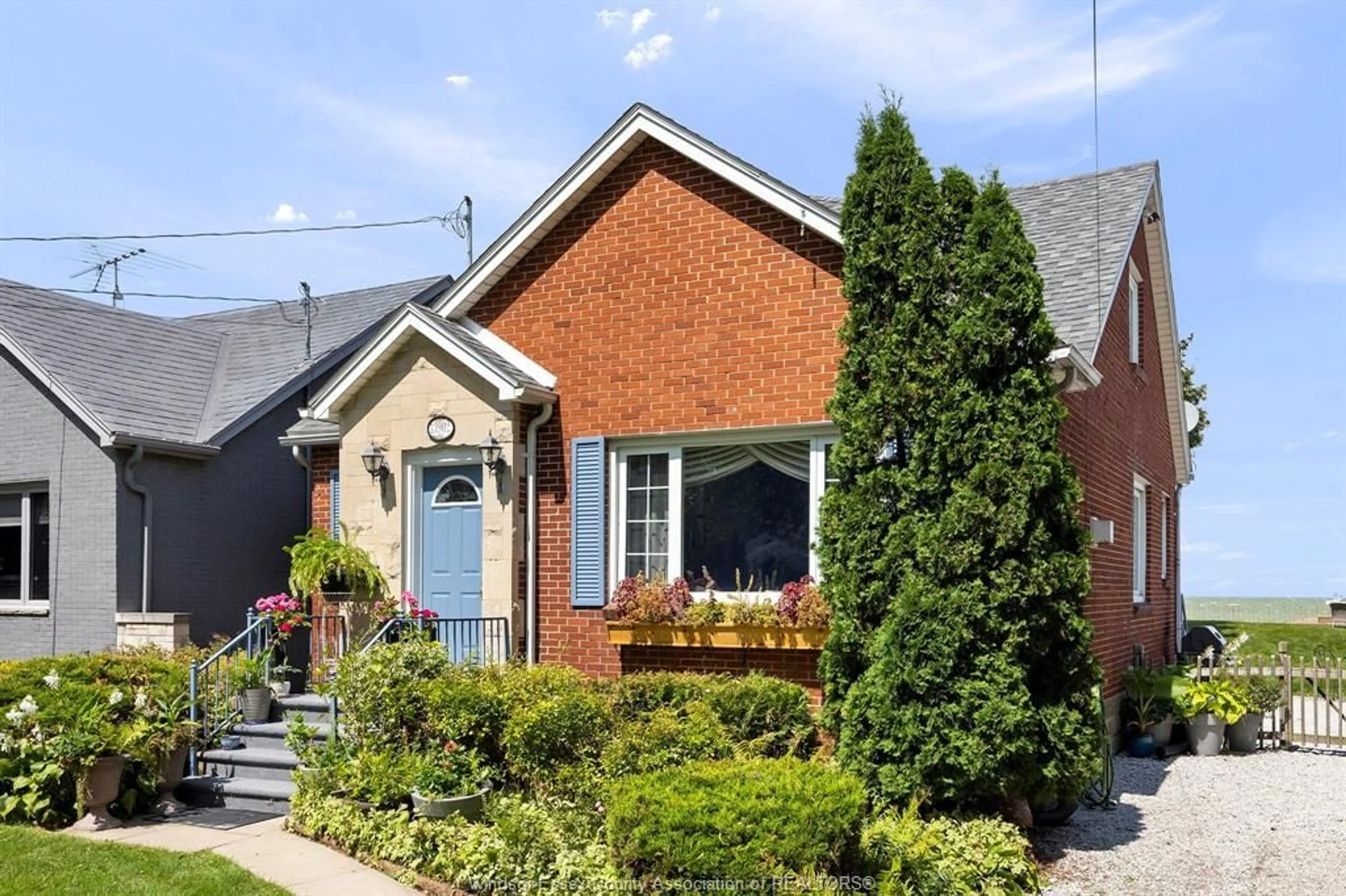 Home with brick exterior material, street for 13902 RIVERSIDE Dr, Tecumseh Ontario N8N 1B6