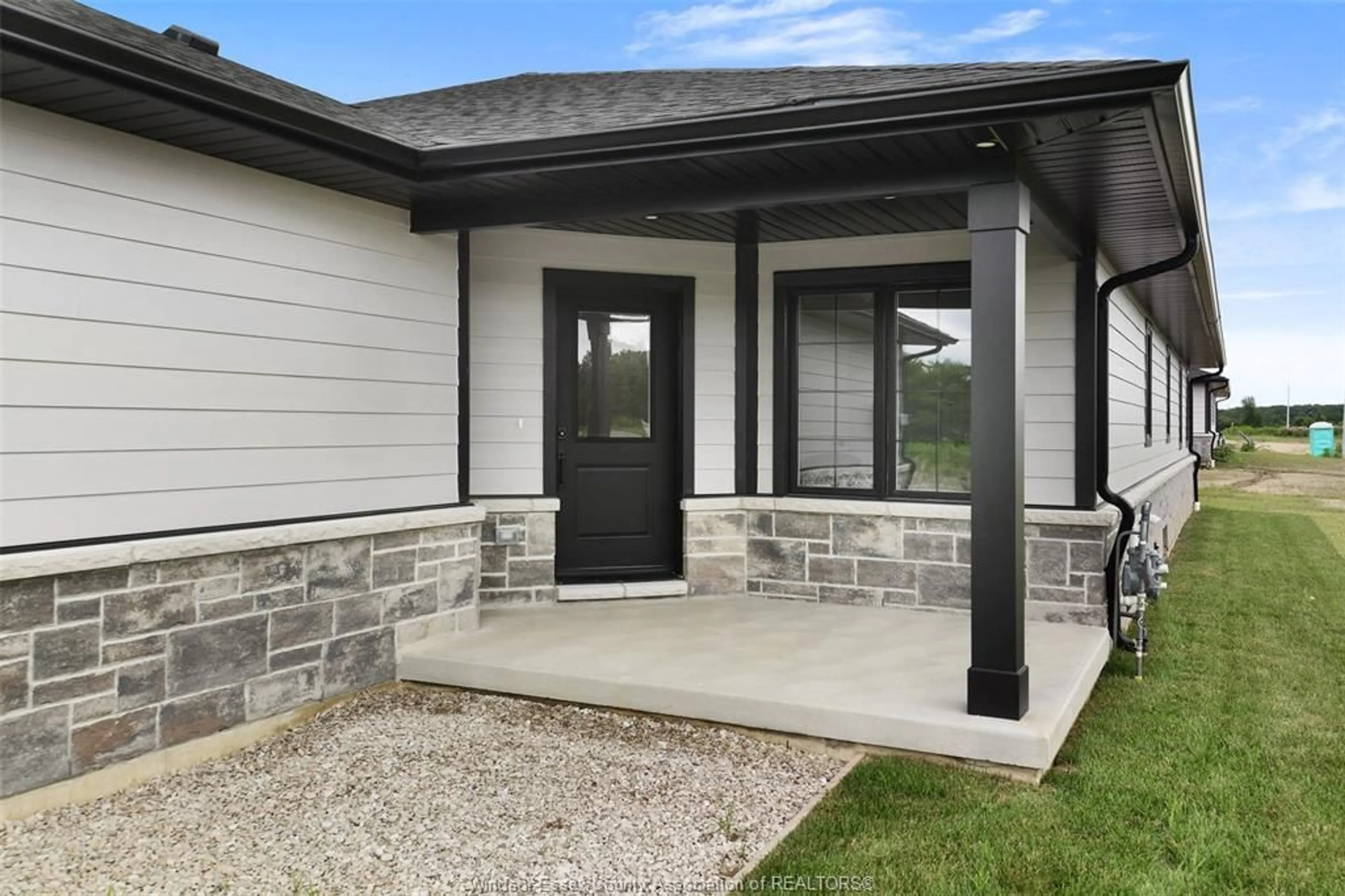 Home with vinyl exterior material, street for 65 MCKENZIE St, Harrow Ontario N0R 1G0
