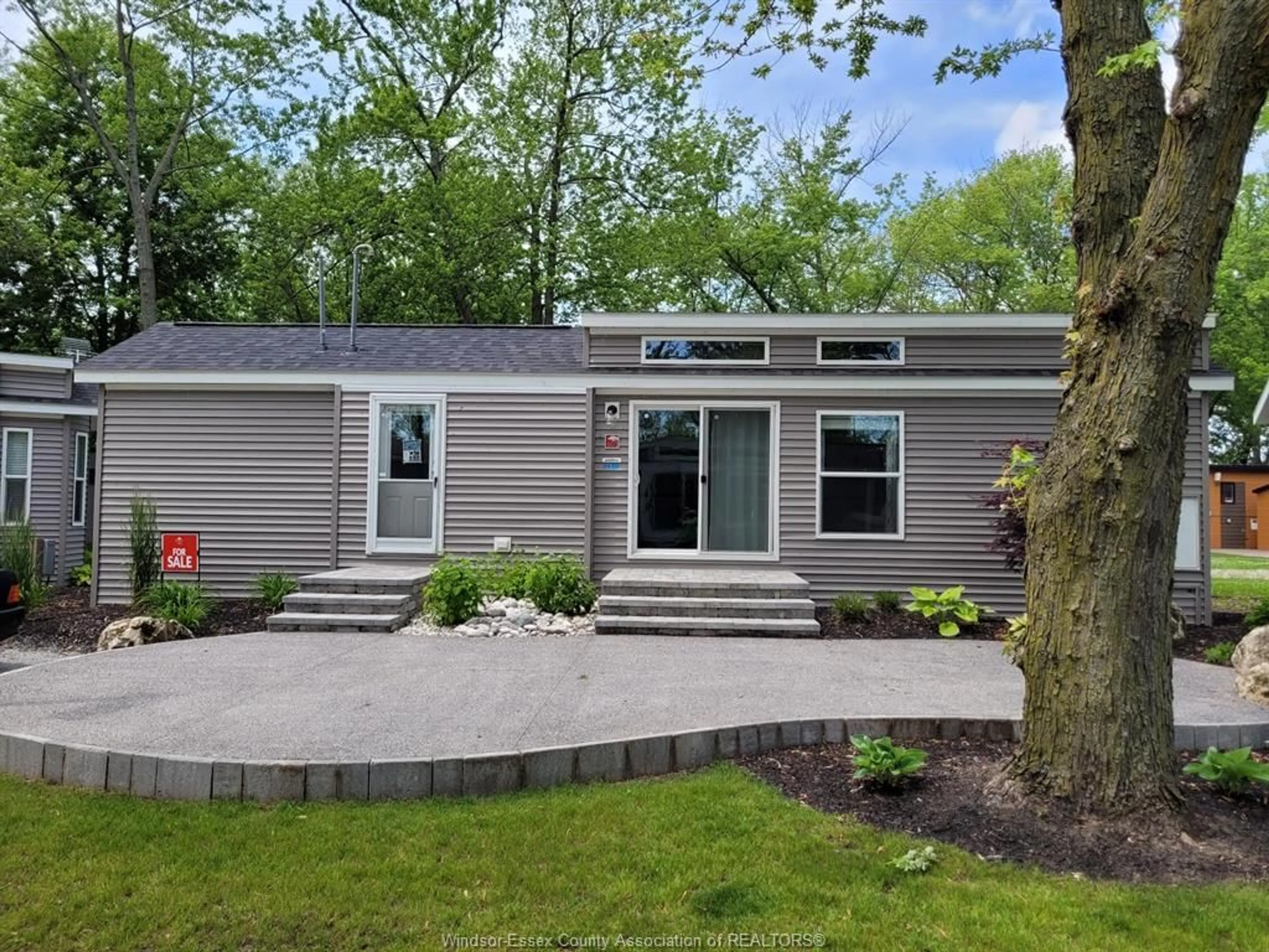Home with vinyl exterior material, street for 981 COUNTY RD 2 #601, Lakeshore Ontario N8L 1B4