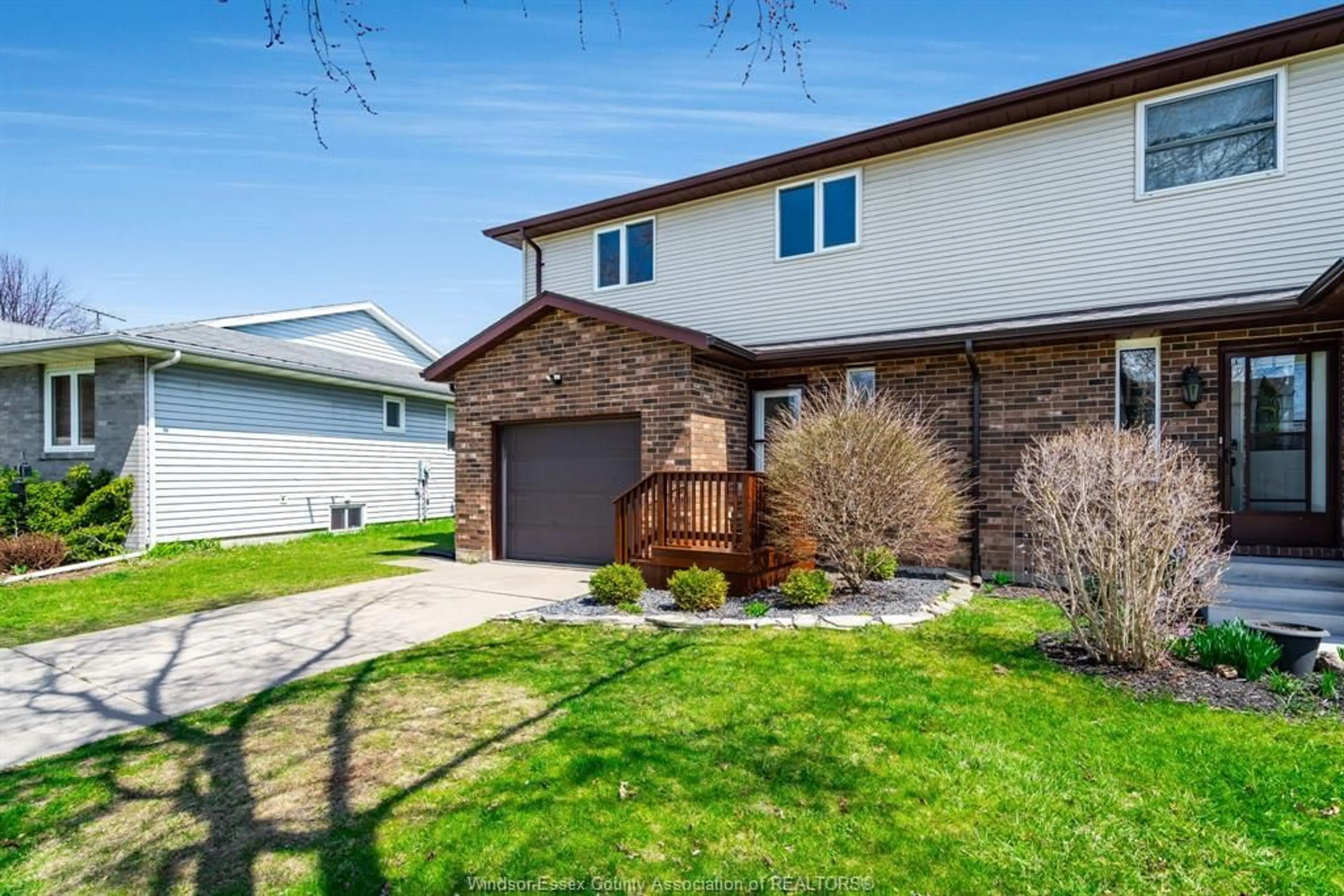 Home with vinyl exterior material, street for 12 Wallace Ave, Leamington Ontario N8H 5B8