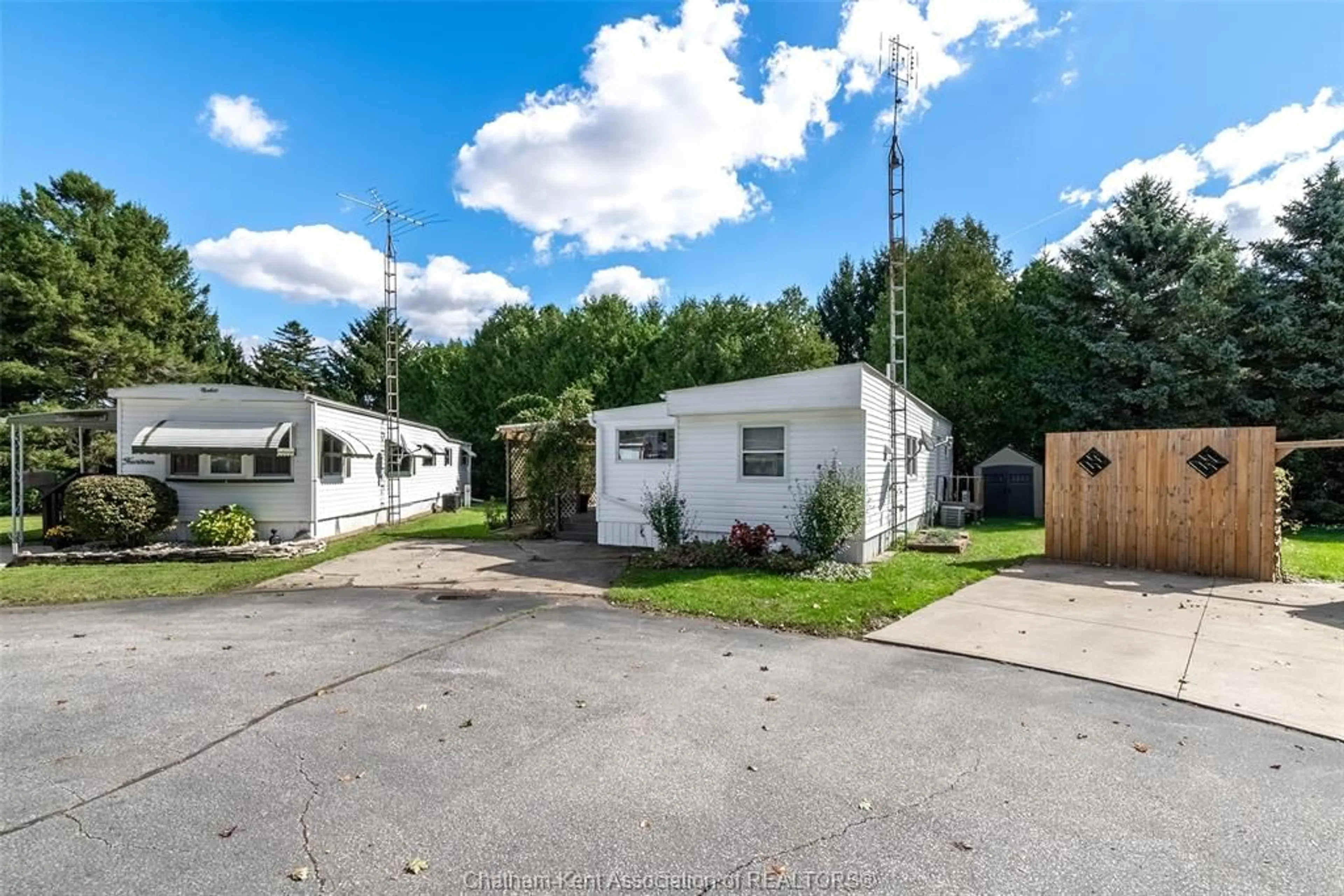 A pic from outside/outdoor area/front of a property/back of a property/a pic from drone, street for 22220 Charing Cross Rd #15, Chatham Ontario N7M 5V8