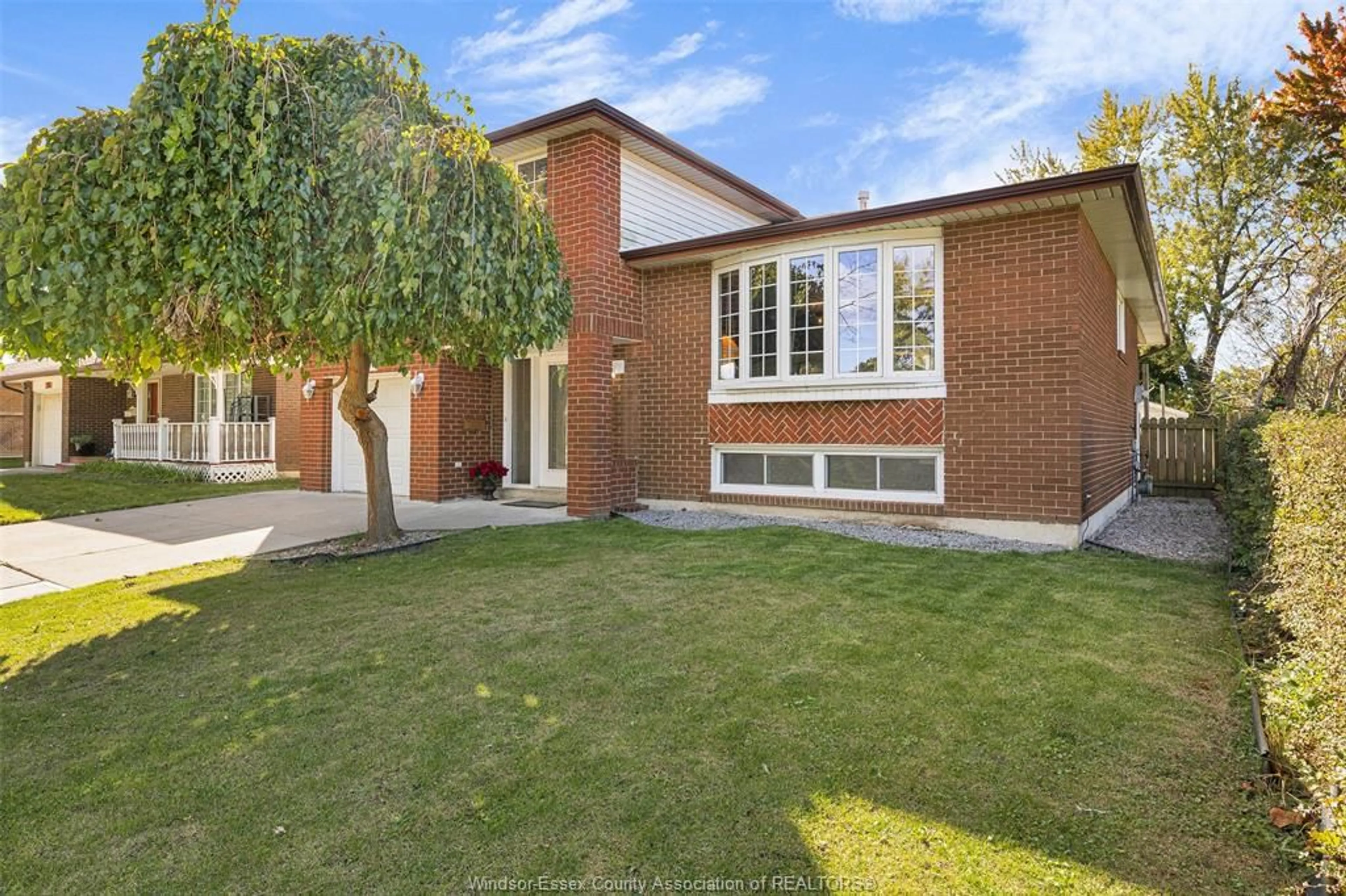 Home with brick exterior material, street for 2855 FOREST GLADE Dr, Windsor Ontario N8R 1L4
