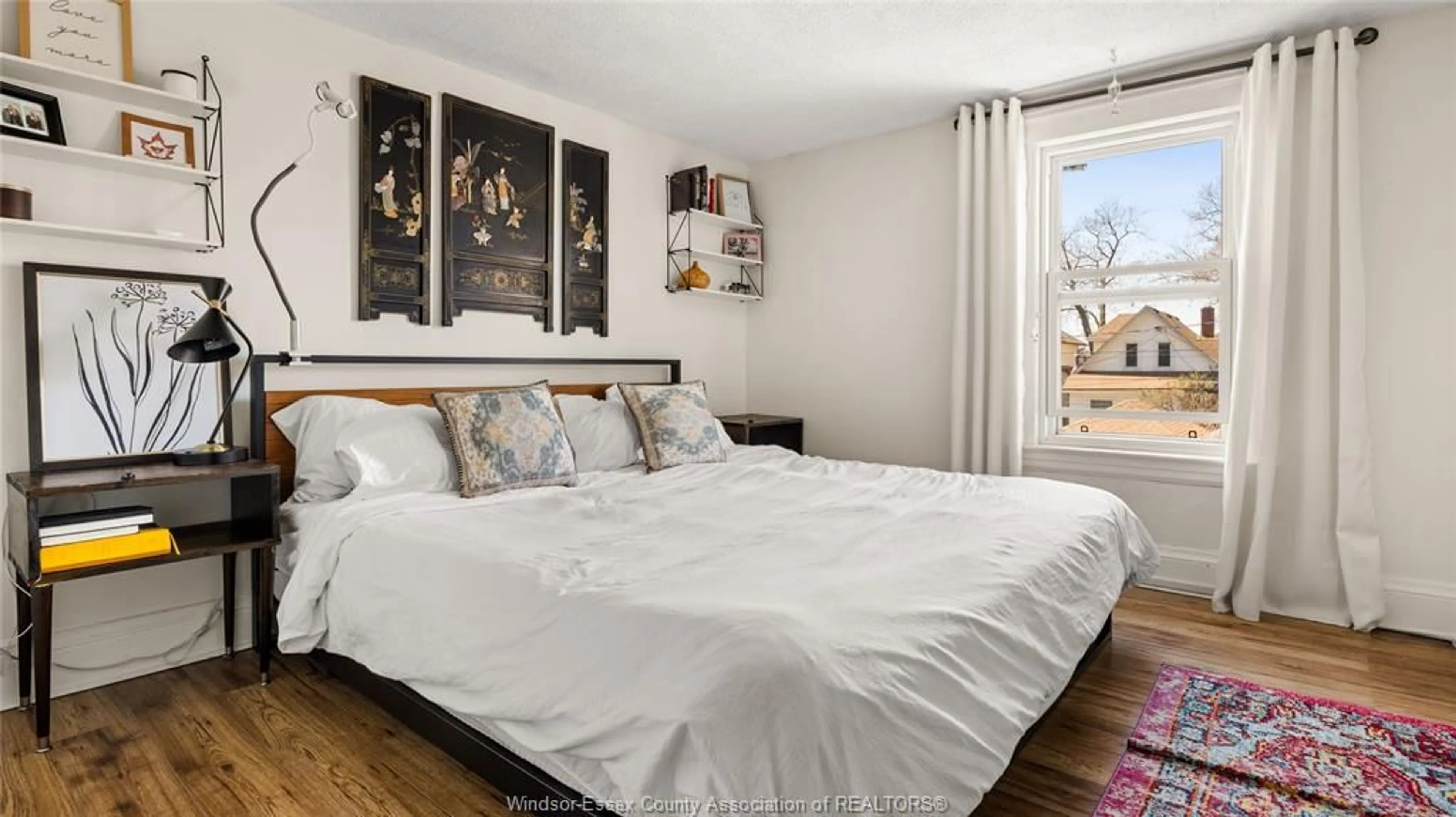 Bedroom with bed, wood/laminate floor for 809 Moy Ave, Windsor Ontario N9A 2N7