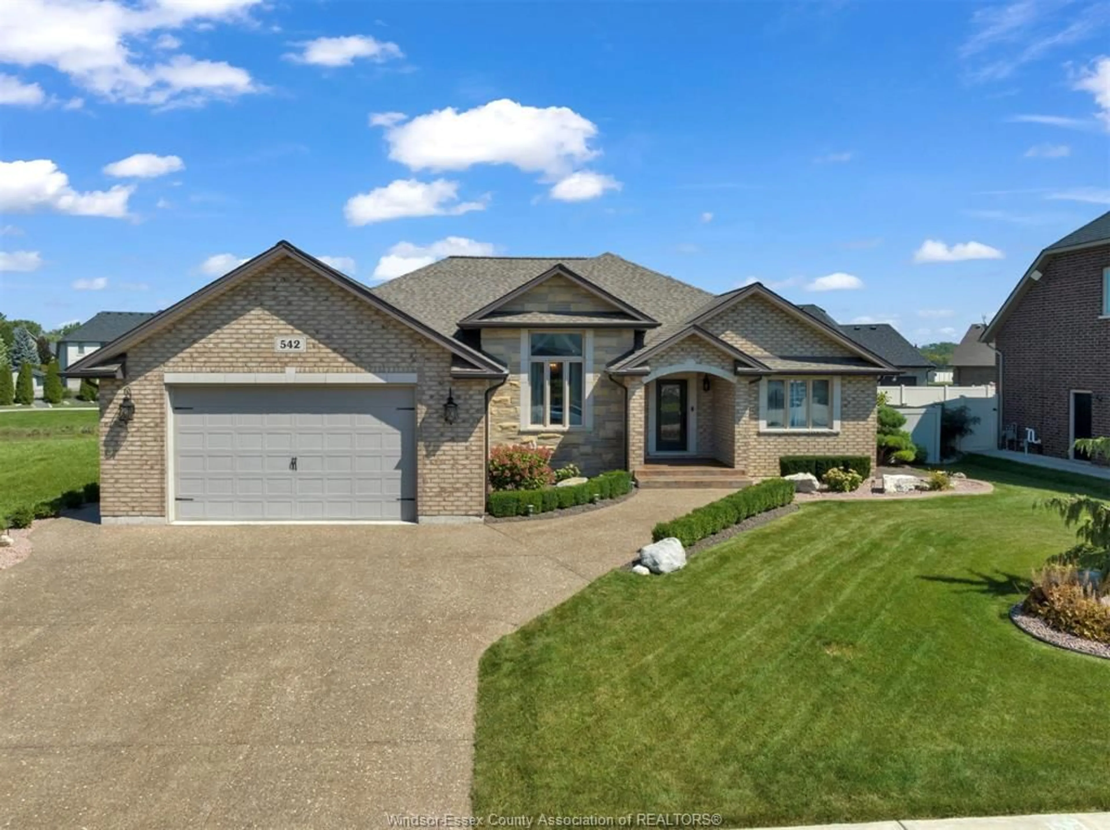 Home with brick exterior material, street for 542 RIVER DOWNS, Lakeshore Ontario N0R 1A0