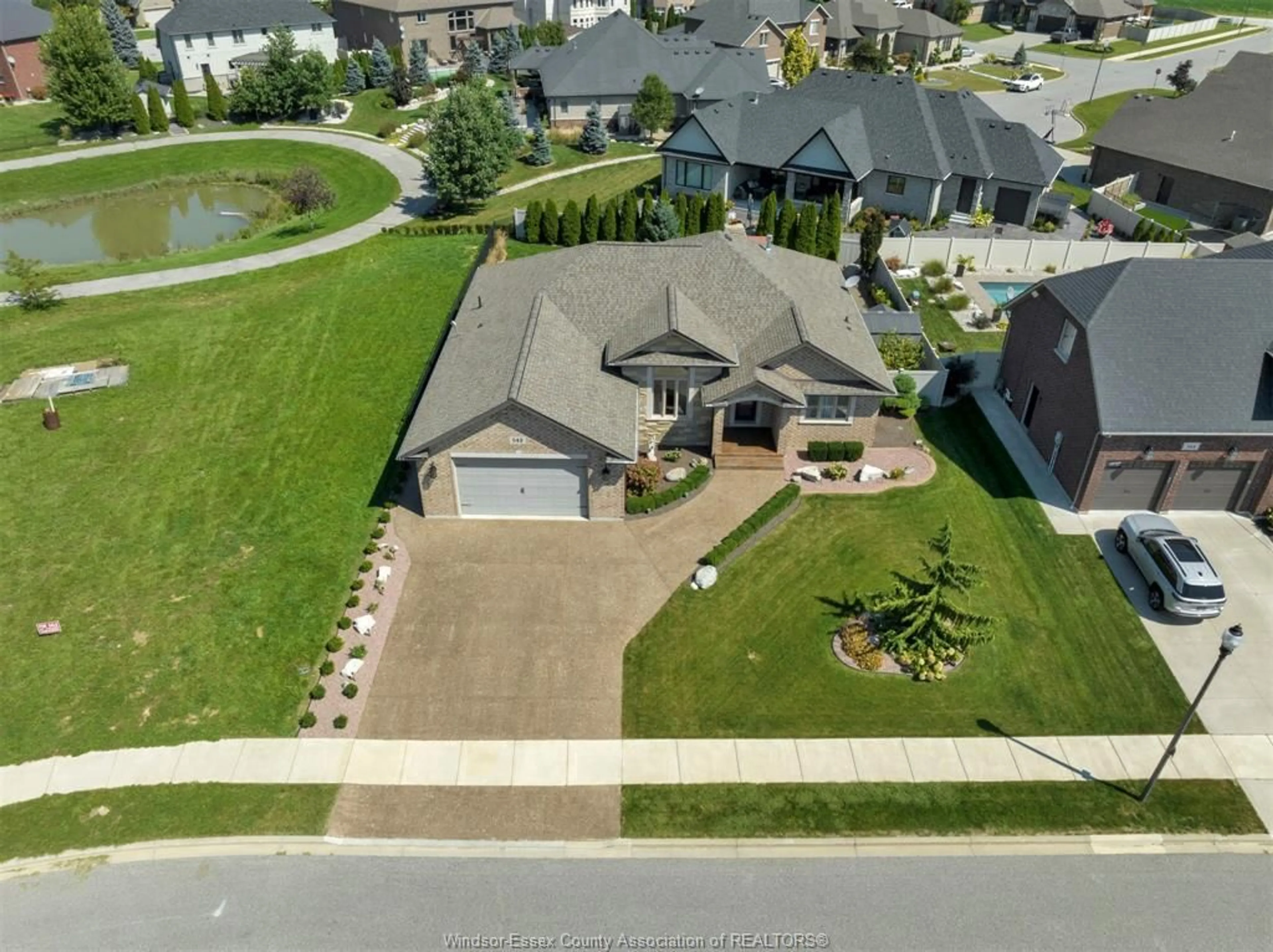 A pic from outside/outdoor area/front of a property/back of a property/a pic from drone, street for 542 RIVER DOWNS, Lakeshore Ontario N0R 1A0