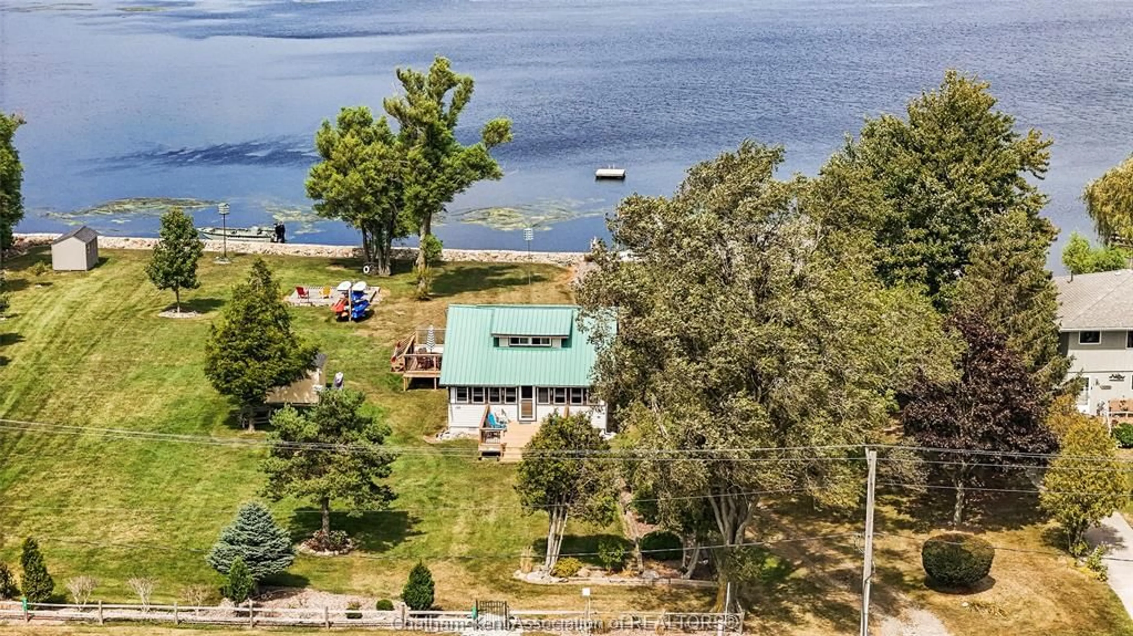 A pic from outside/outdoor area/front of a property/back of a property/a pic from drone, water/lake/river/ocean view for 120 ROSS Lane, Erieau Ontario N0P 1N0
