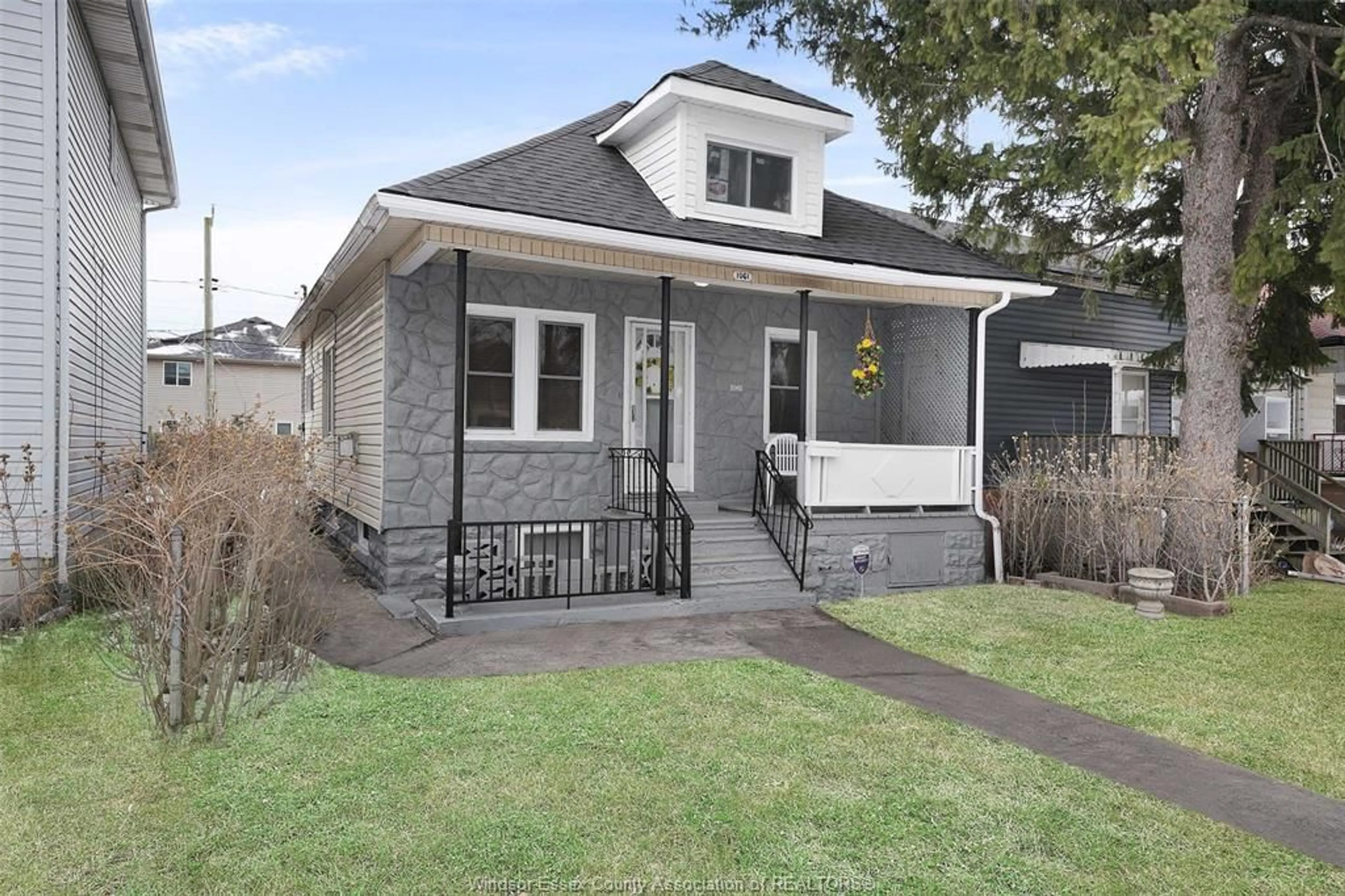 Home with brick exterior material, street for 1061 HIGHLAND Ave, Windsor Ontario N9A 1R6