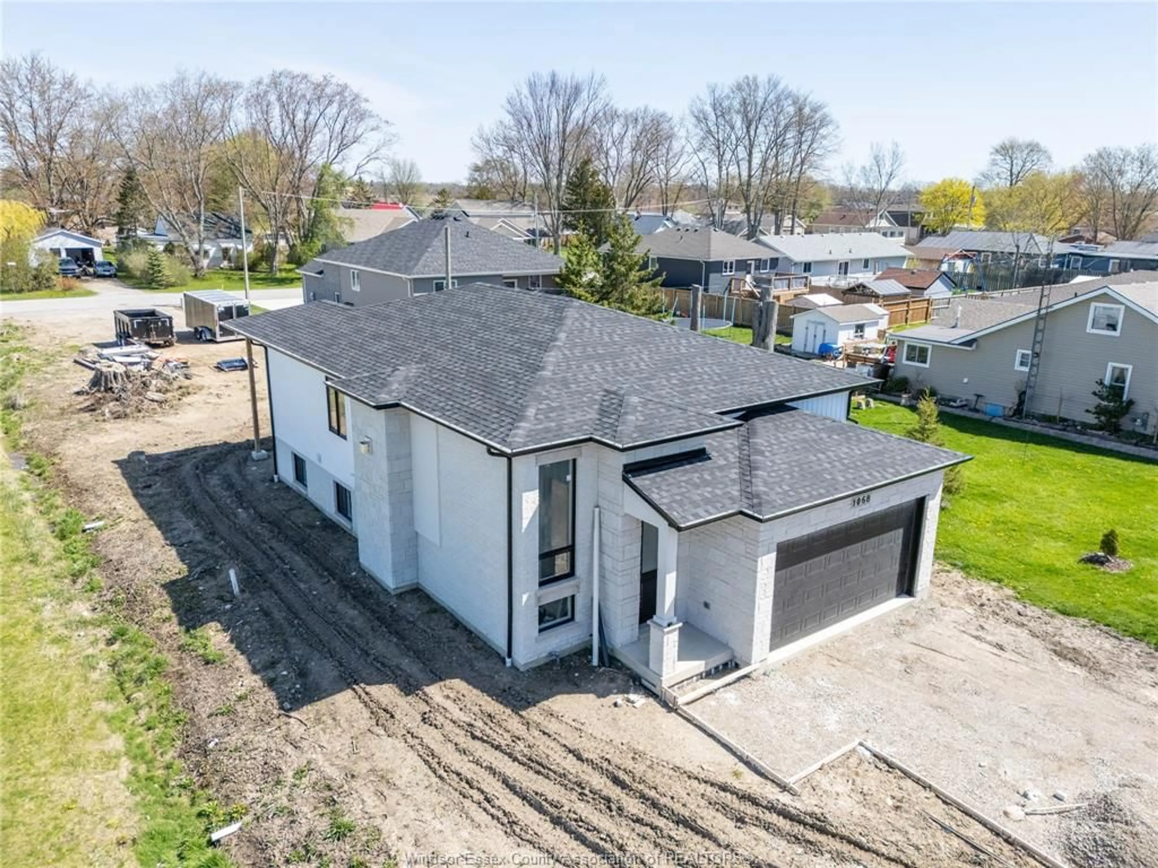 A pic from outside/outdoor area/front of a property/back of a property/a pic from drone, street for 1068 BIRCH Ave, Kingsville Ontario N9Y 3V1