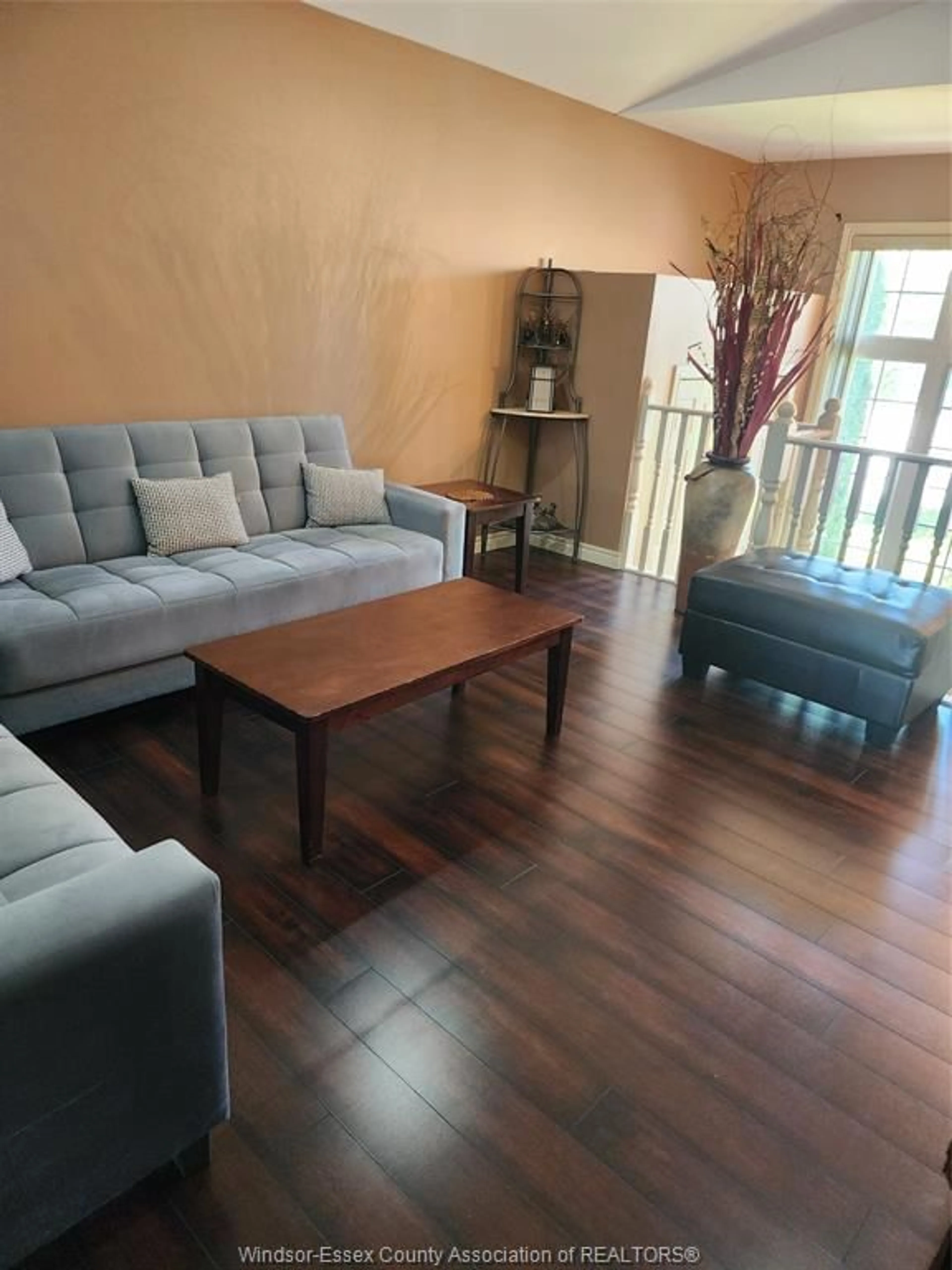 Living room with furniture, wood/laminate floor for 3142 SEVILLE Ave, Windsor Ontario N8N 0A2