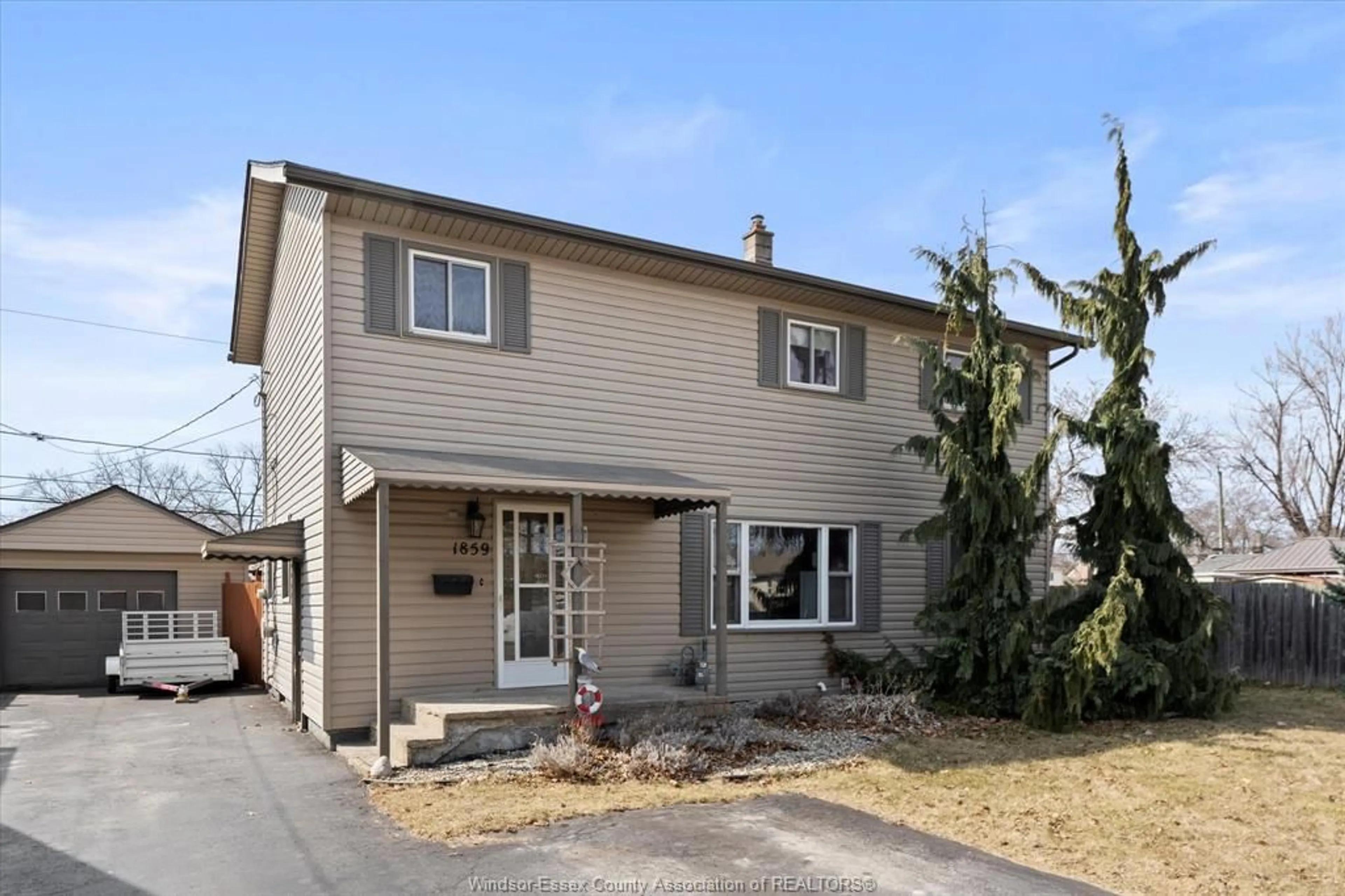 Home with vinyl exterior material, street for 1859 Ford Blvd, Windsor Ontario N8T 2E2