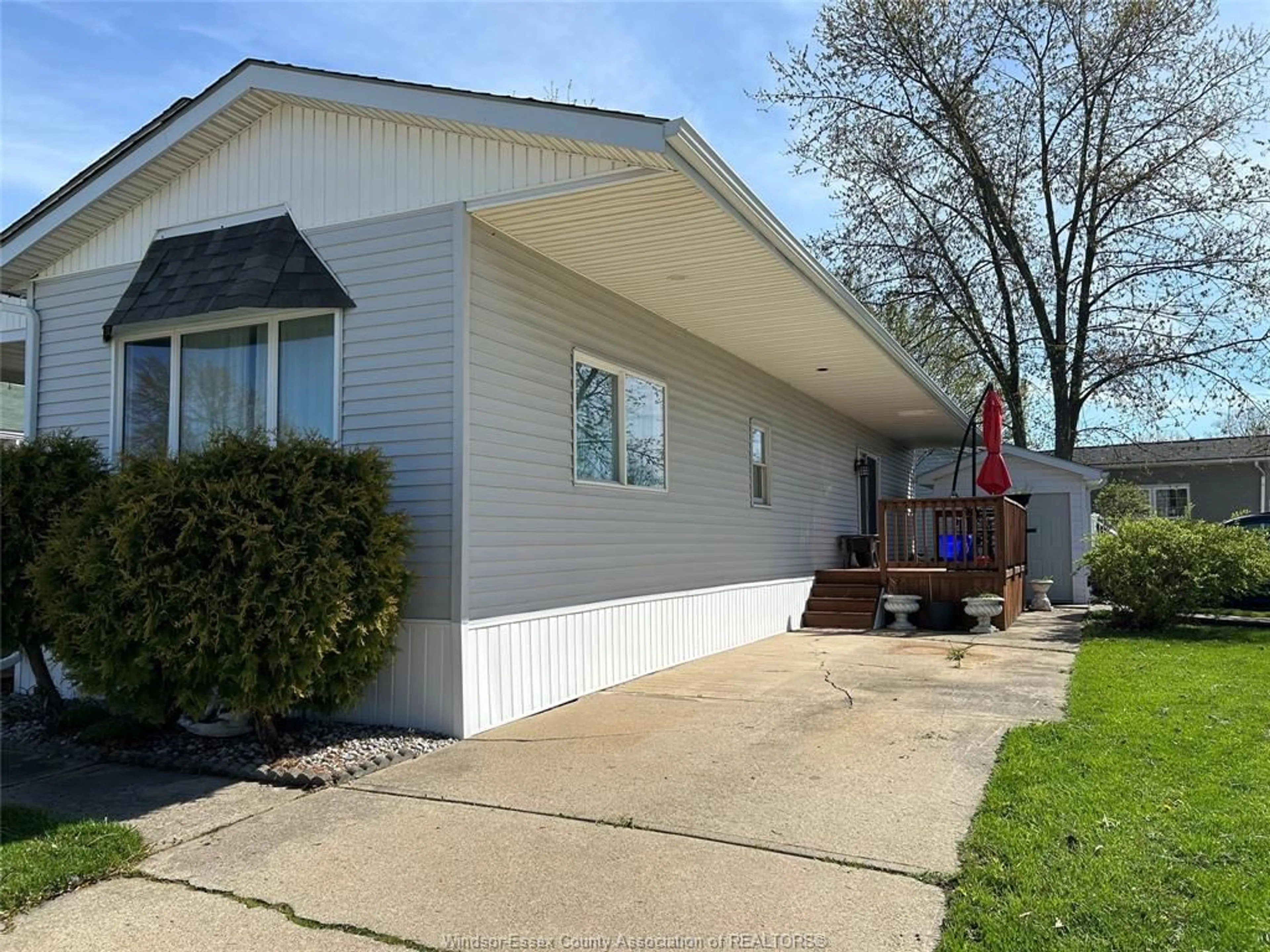 Home with vinyl exterior material, street for 27 SPRUCE, McGregor Ontario N0R 1J0