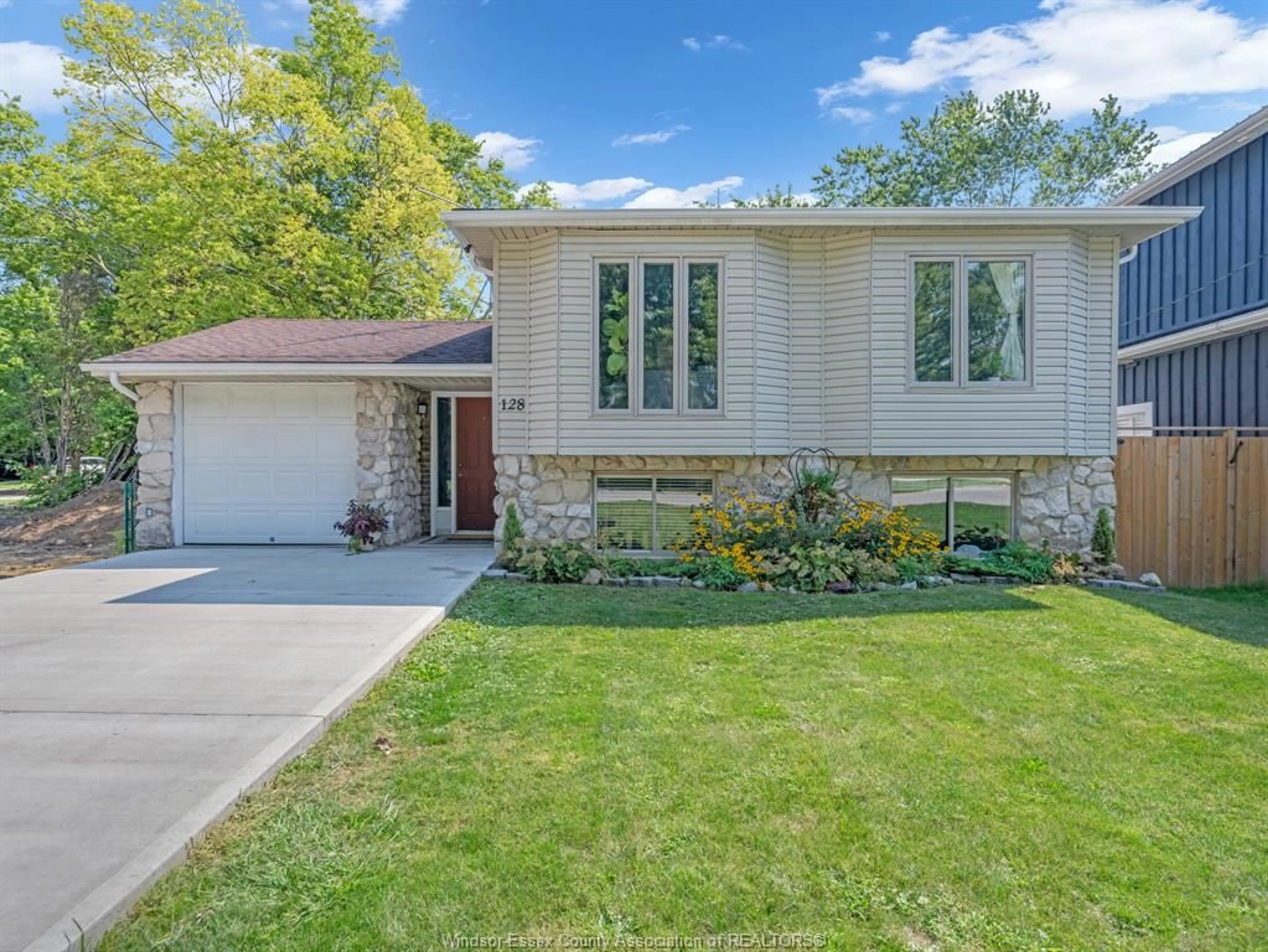Home with brick exterior material, street for 128 BELLCREFT Dr, Harrow Ontario N0R 1G0