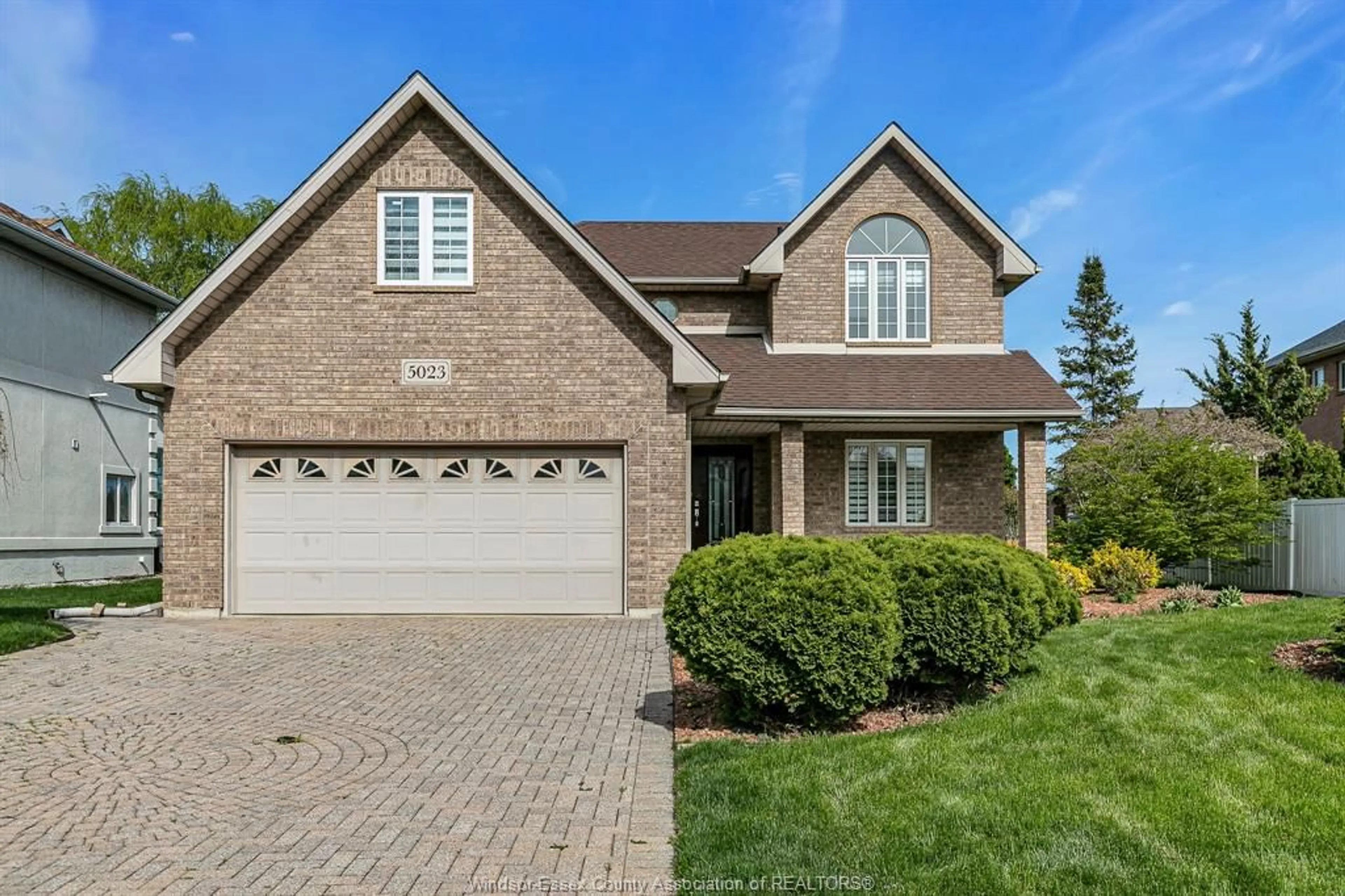 Home with brick exterior material, street for 5023 SOUTHWOOD LAKES, Windsor Ontario N9G 2Y1