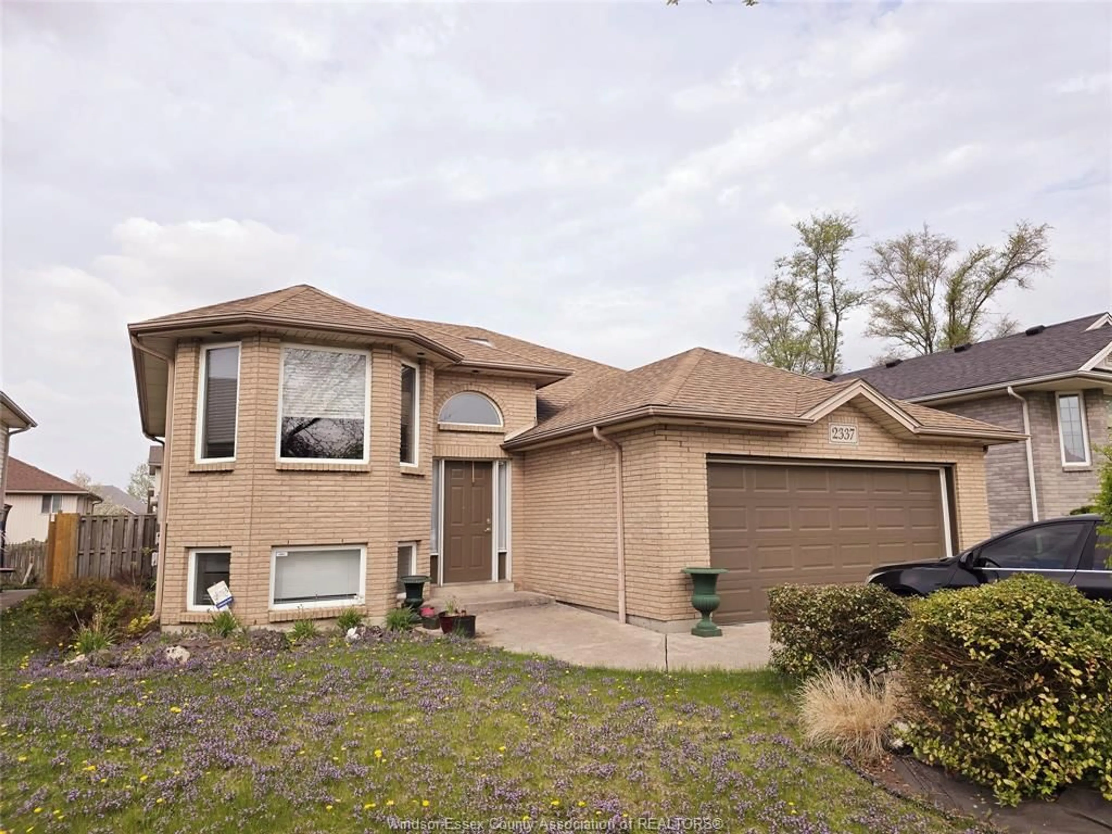 Home with vinyl exterior material, street for 2337 ST. CLAIR, Windsor Ontario N9E 4S7