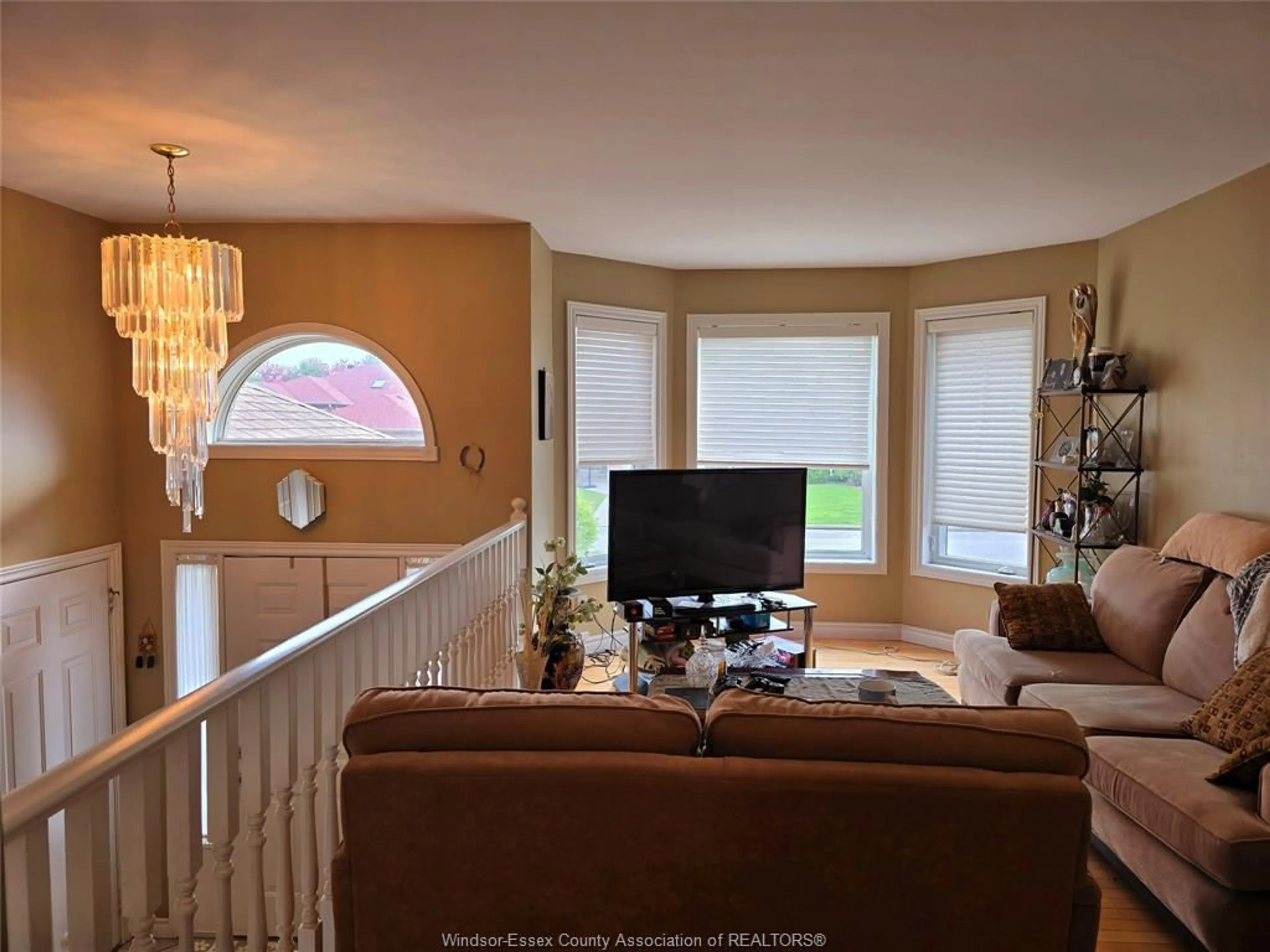 Living room with furniture, wood/laminate floor for 2337 ST. CLAIR, Windsor Ontario N9E 4S7
