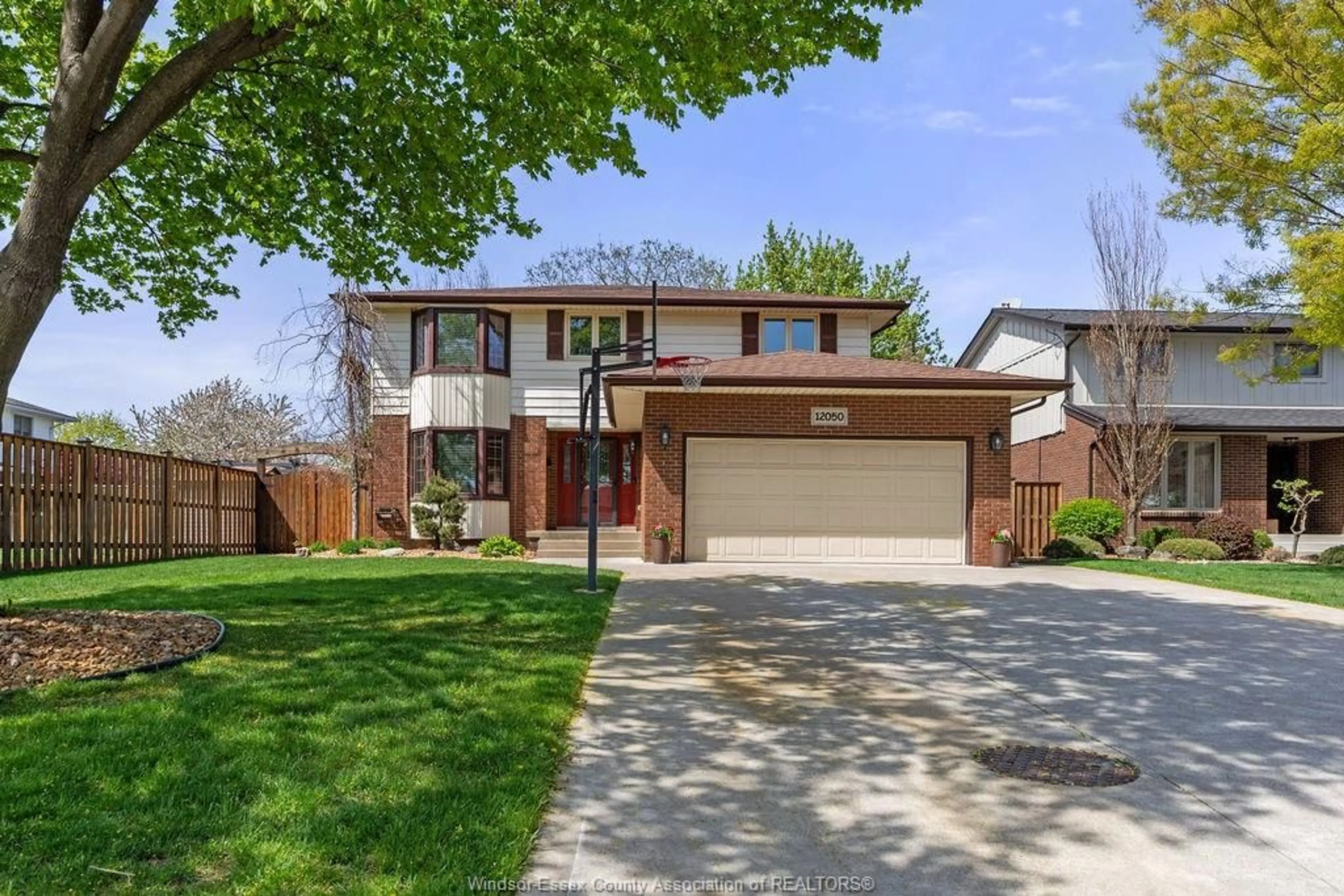 Home with brick exterior material, street for 12050 APPLETREE Cres, Tecumseh Ontario N8N 4A5