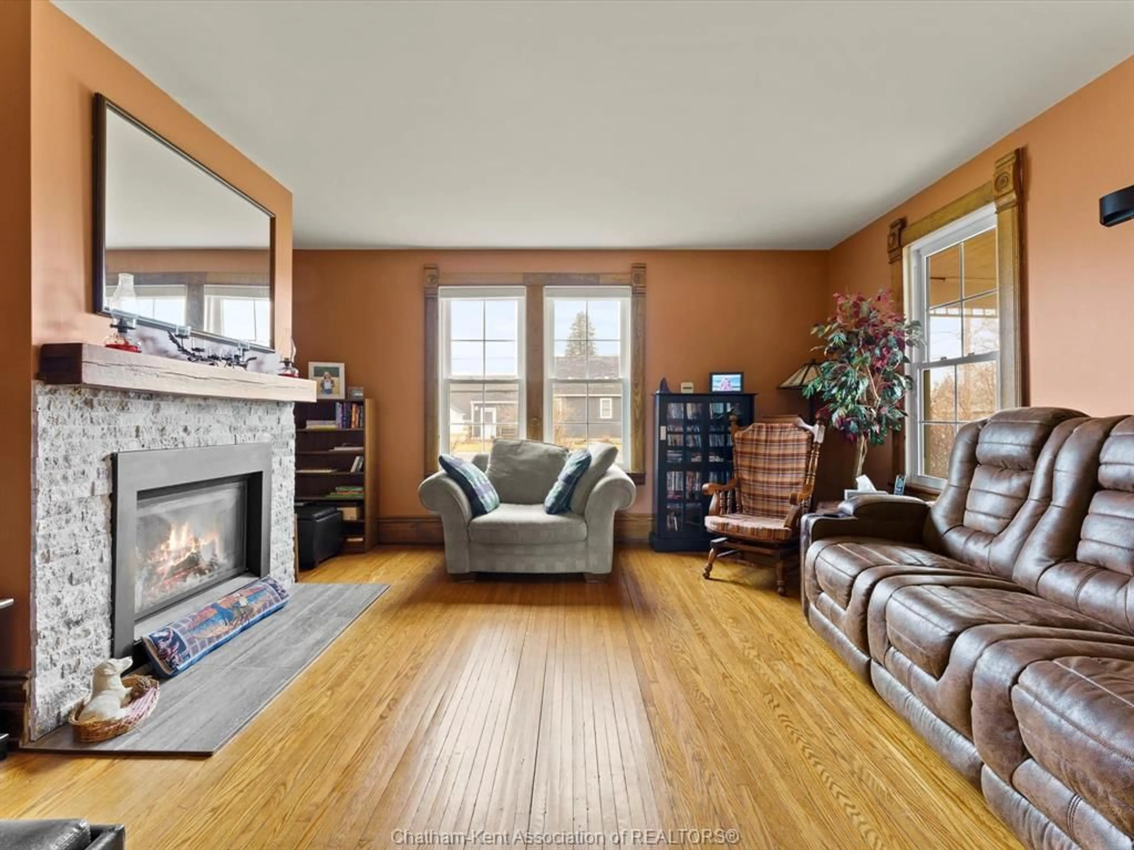 Living room with furniture, wood/laminate floor for 42 Middleton Line, Wheatley Ontario N0P 2P0