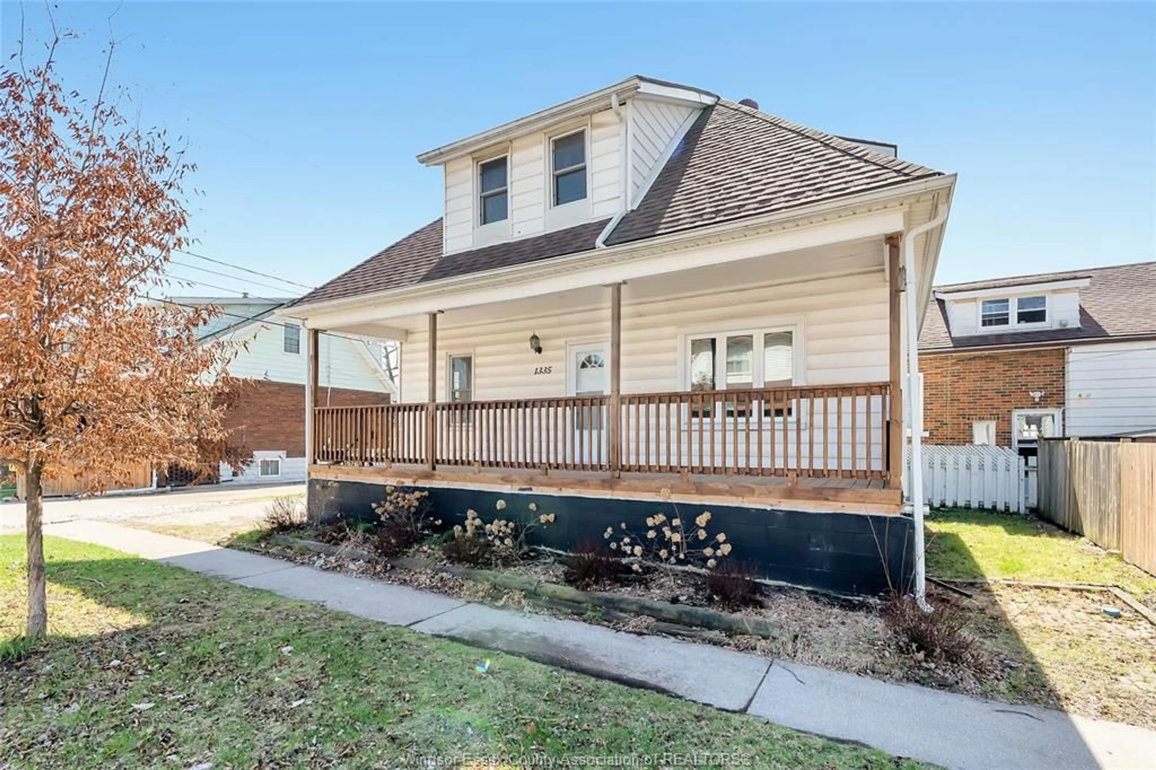 Home with vinyl exterior material, street for 1335 Richmond St, Windsor Ontario N9A 4A9