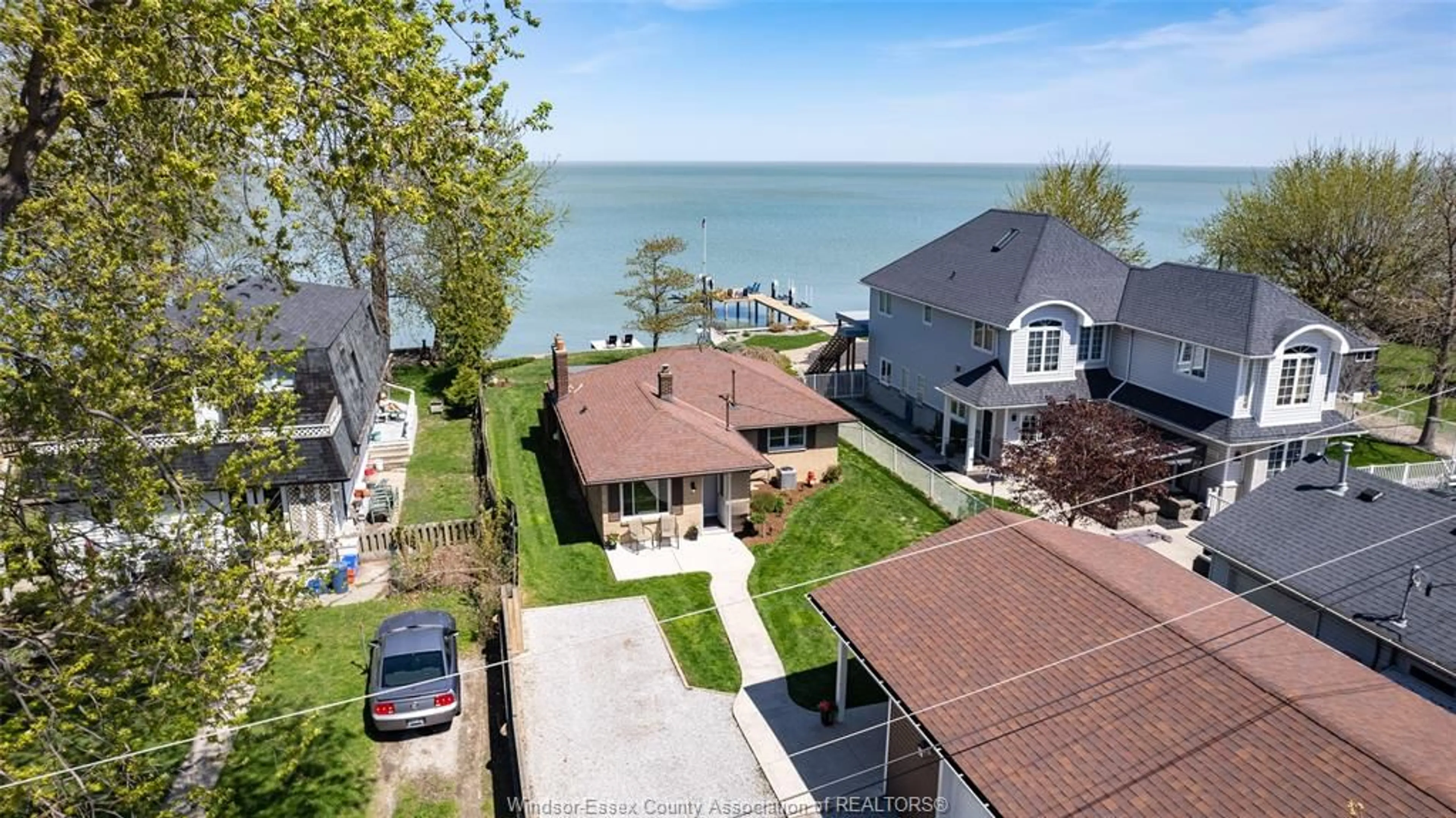 A pic from outside/outdoor area/front of a property/back of a property/a pic from drone, water/lake/river/ocean view for 451 CHARRON BEACH Rd, Lakeshore Ontario N8L 1J5