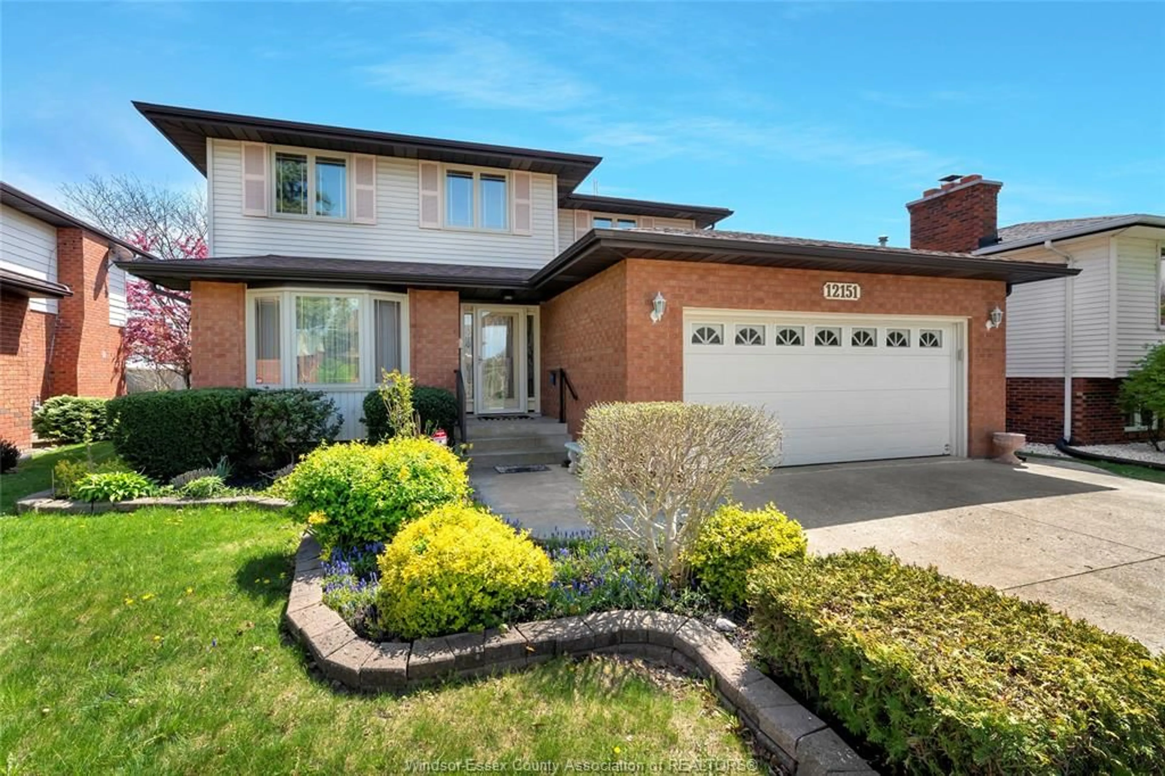 Home with brick exterior material, street for 12151 ORCHARD Dr, Tecumseh Ontario N8N 4A2