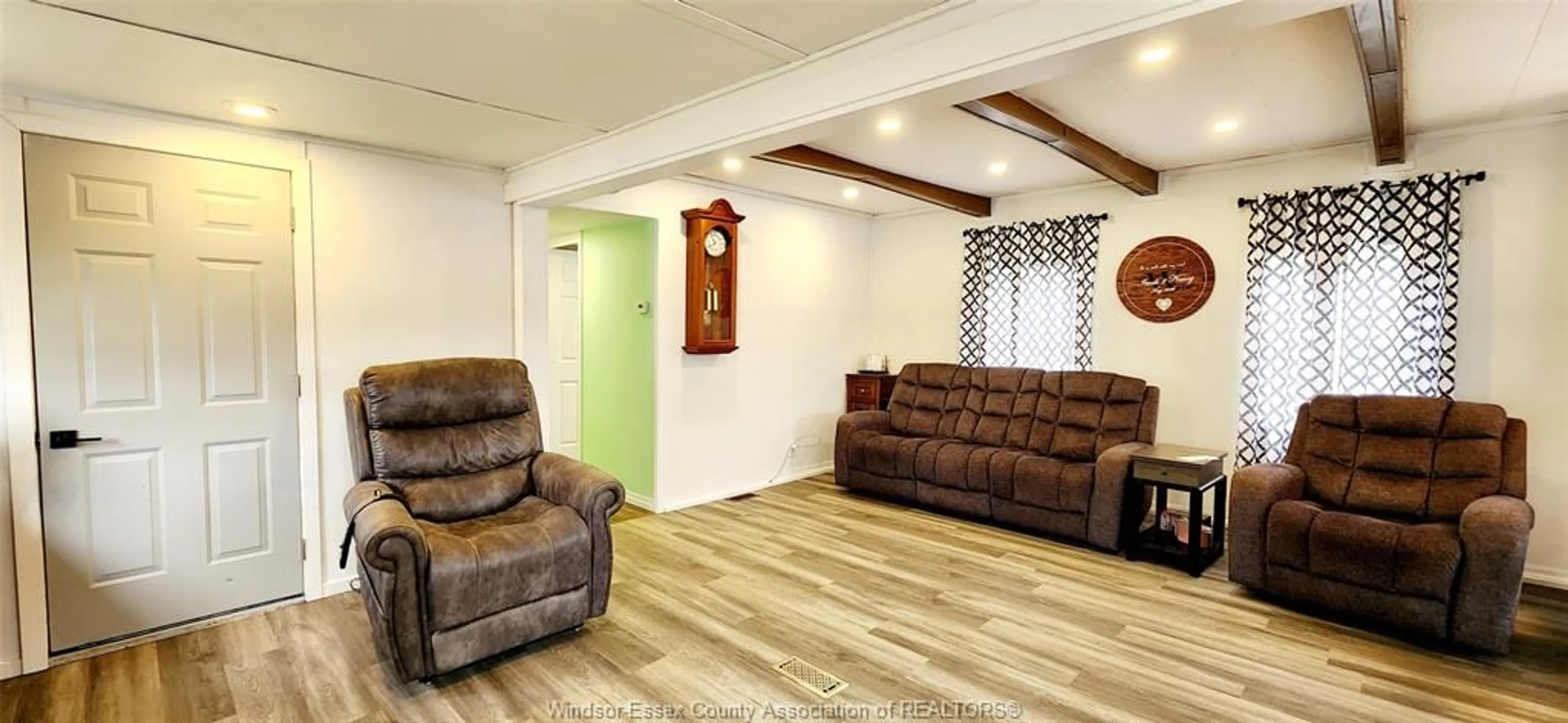 Living room with furniture, wood/laminate floor for 40 PARKSIDE Dr, McGregor Ontario N0R 1J0