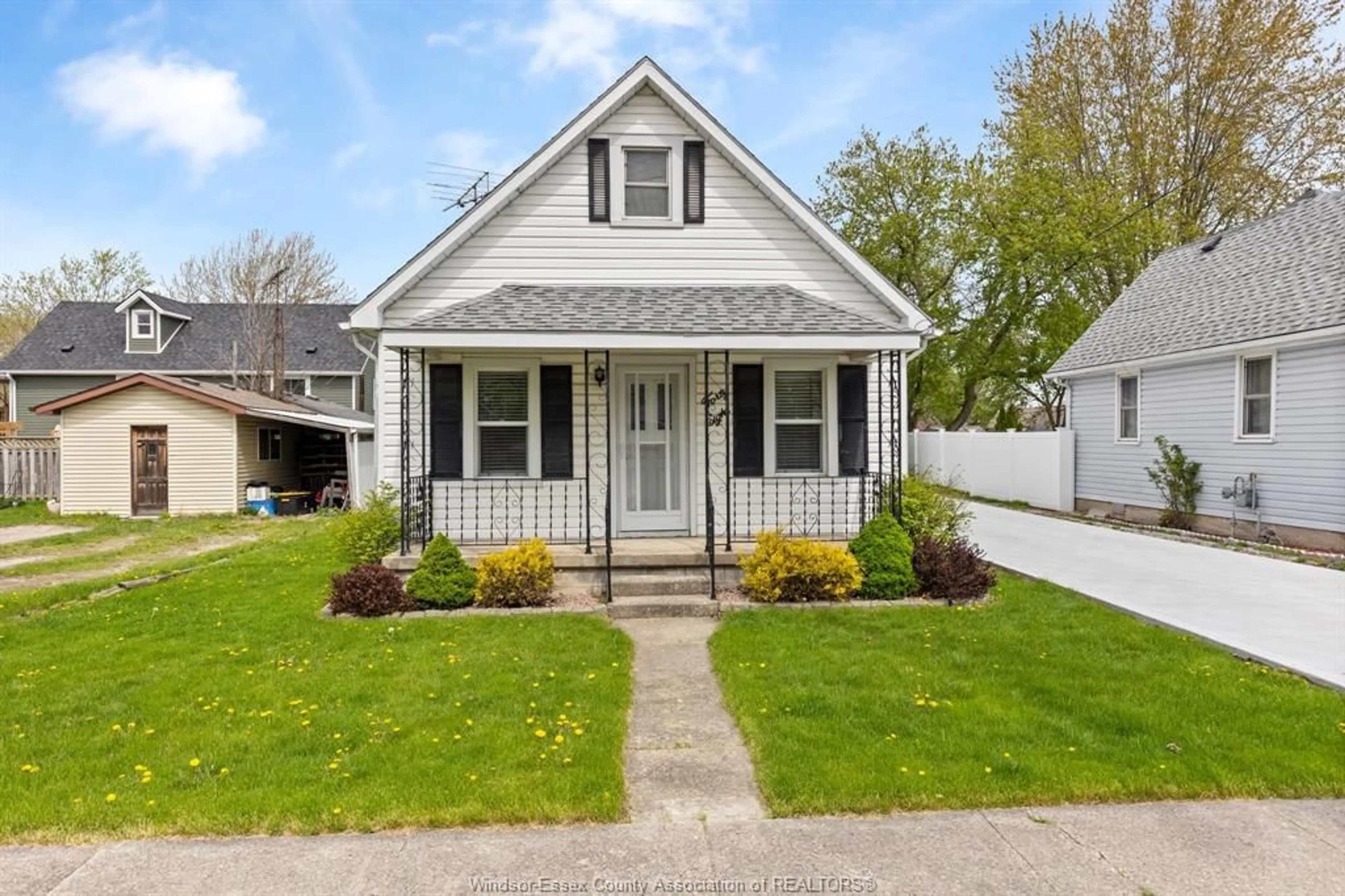 Home with vinyl exterior material, street for 48 CANAL St, Tilbury Ontario N0P 2L0