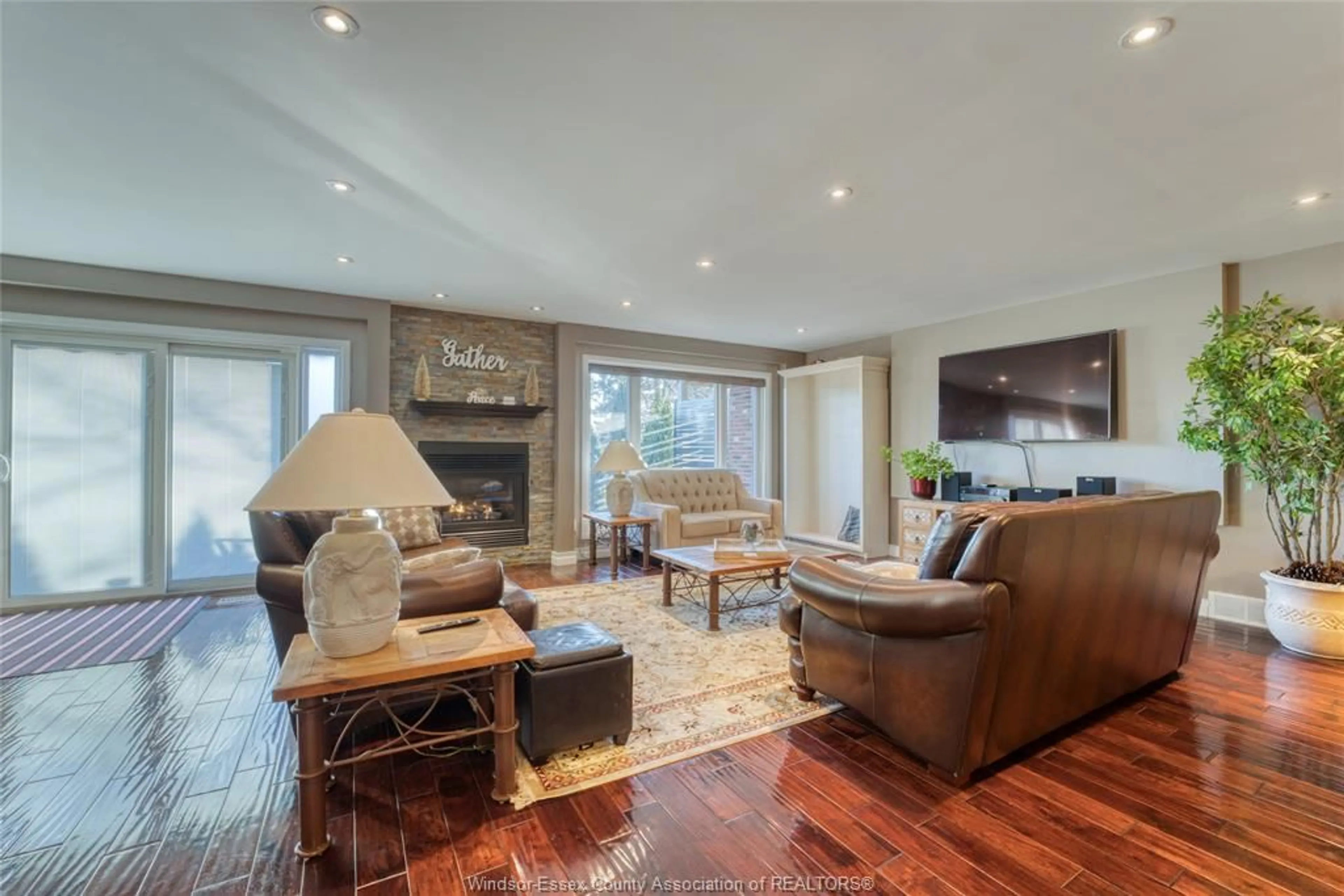 Living room with furniture, wood/laminate floor for 63 FAIRWAY Cres, Amherstburg Ontario N9V 3T7