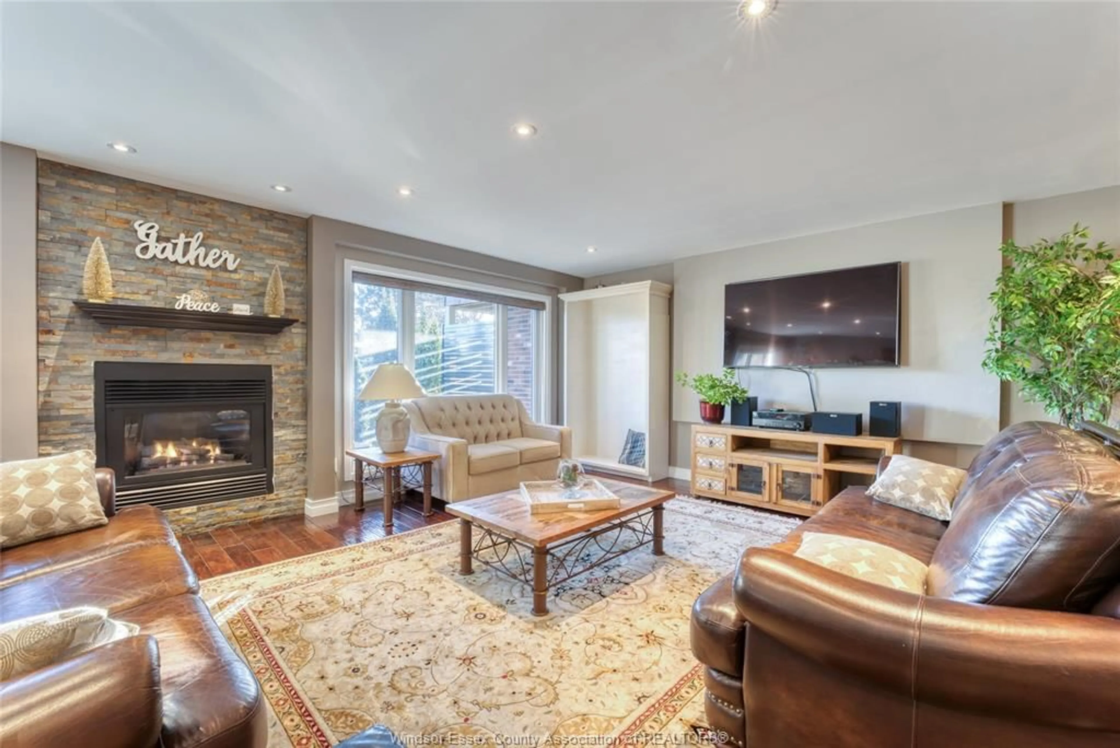 Living room with furniture, wood/laminate floor for 63 FAIRWAY Cres, Amherstburg Ontario N9V 3T7