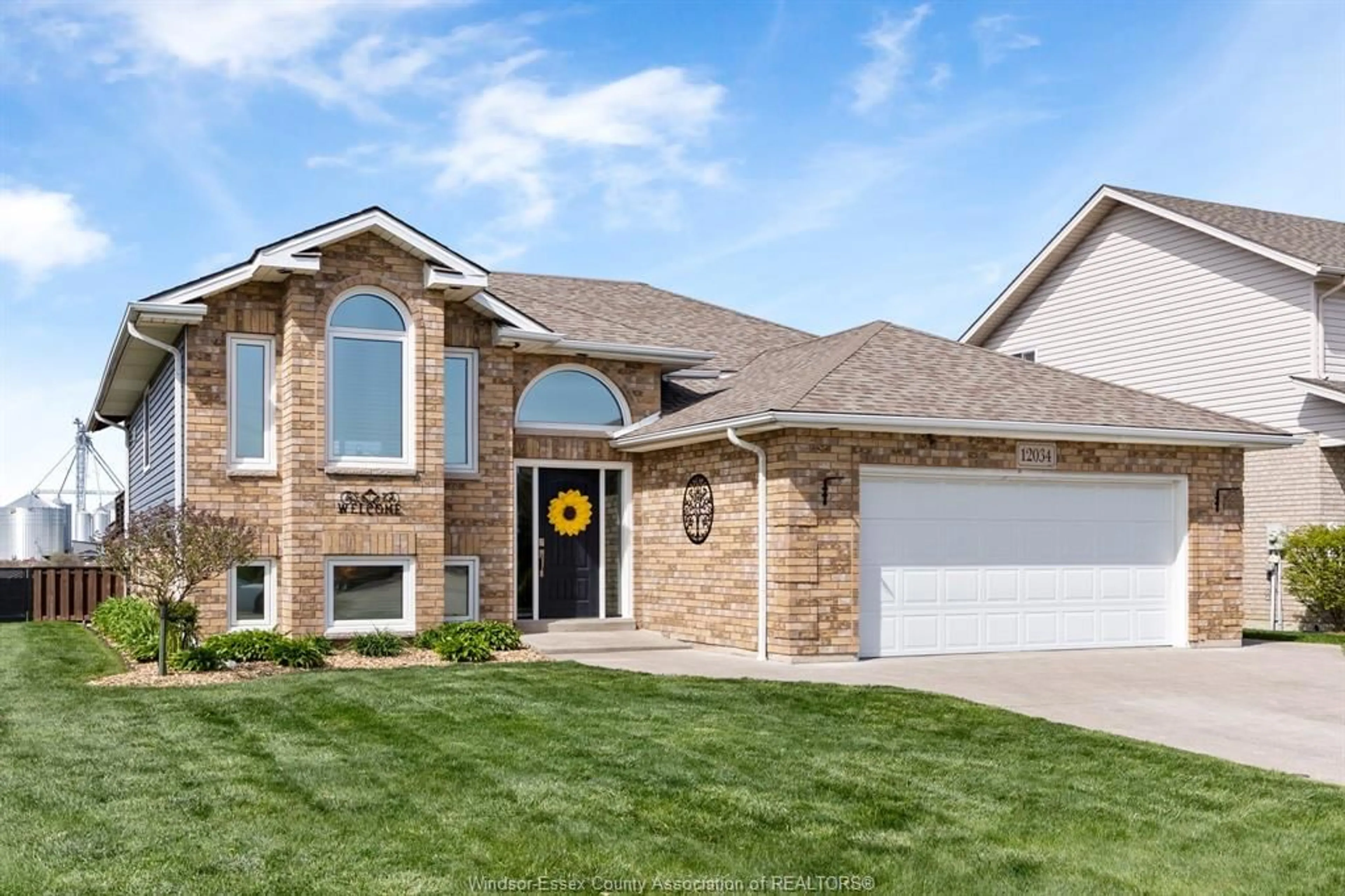 Home with brick exterior material, street for 12034 DUCHARME Lane, Essex Ontario N0R 1J0